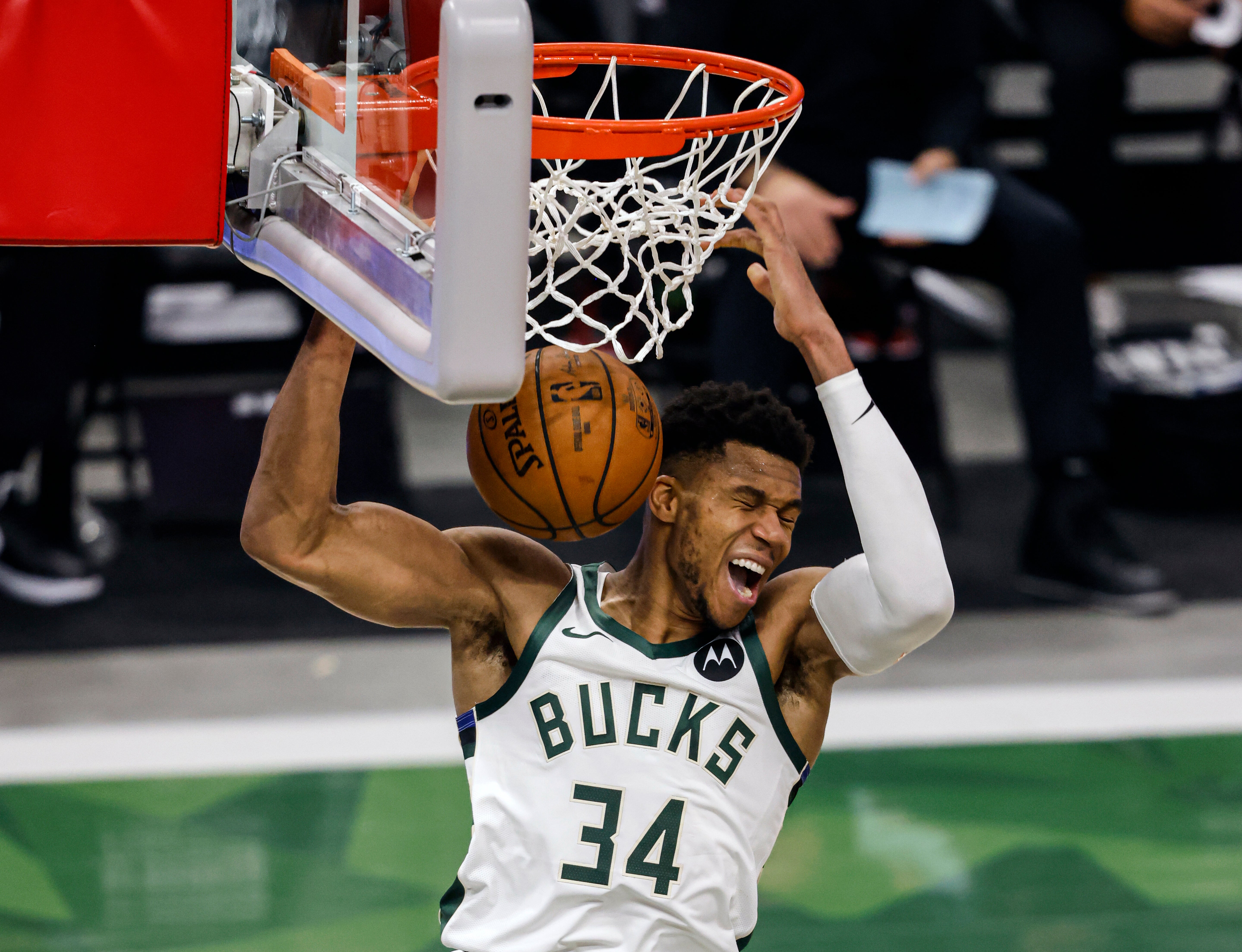 Milwaukee Bucks forward Giannis Antetokounmpo scores a slam dunk