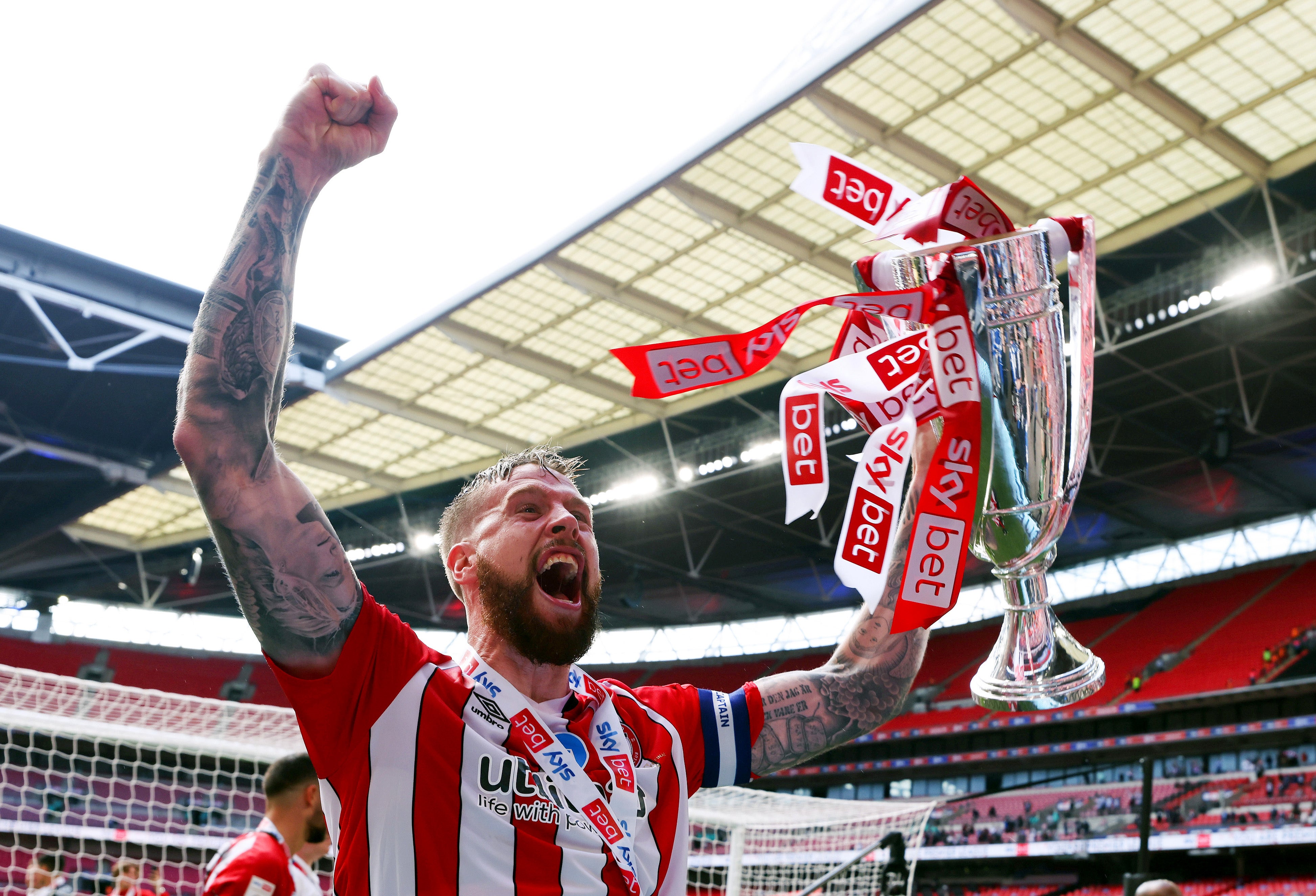 Brentford captain Pontus Jansson celebrates with the trophy after winning the Sky Bet Championship Play-off Final