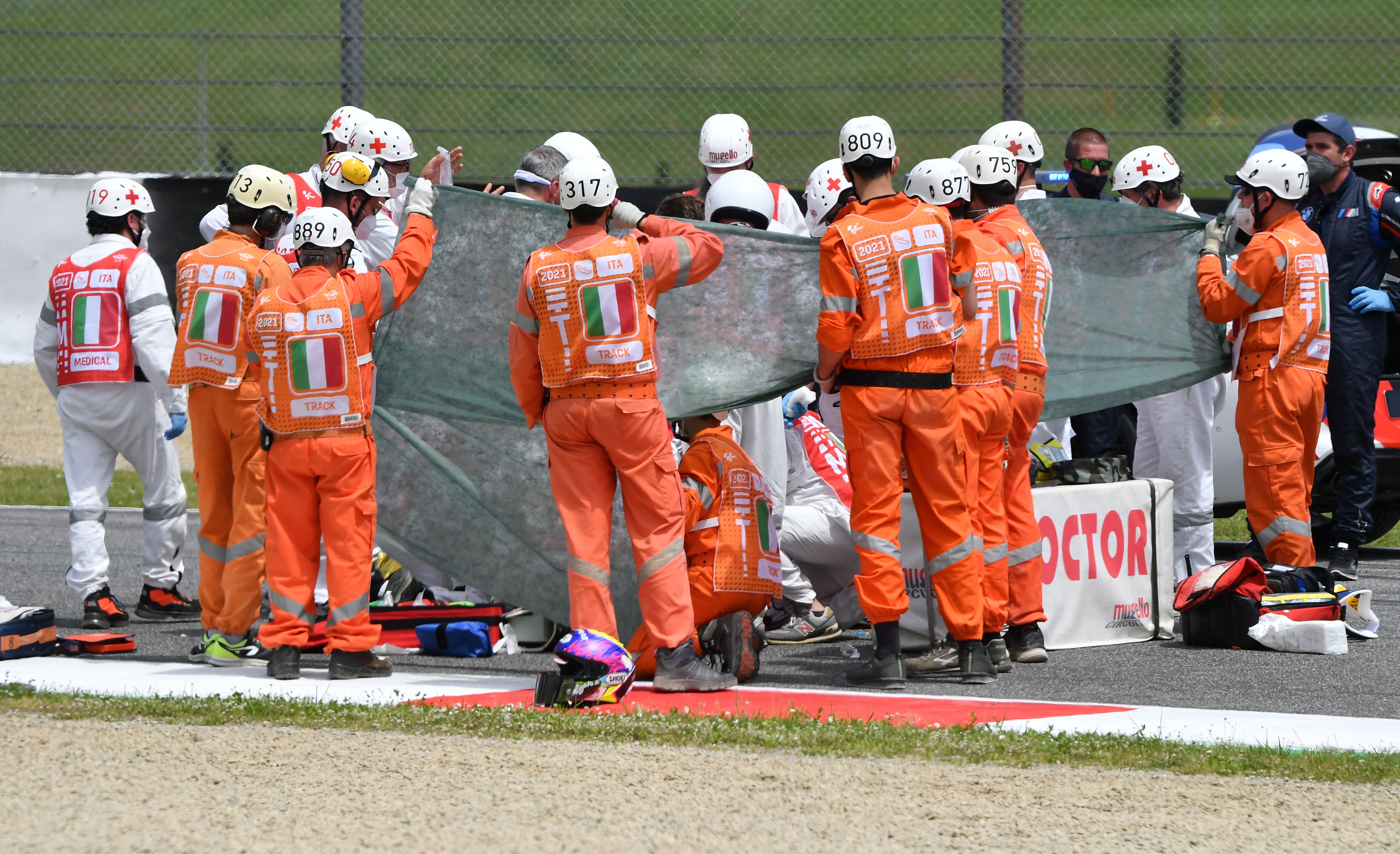 Medical officers tend to Swiss Moto3 rider Jason Dupasquier