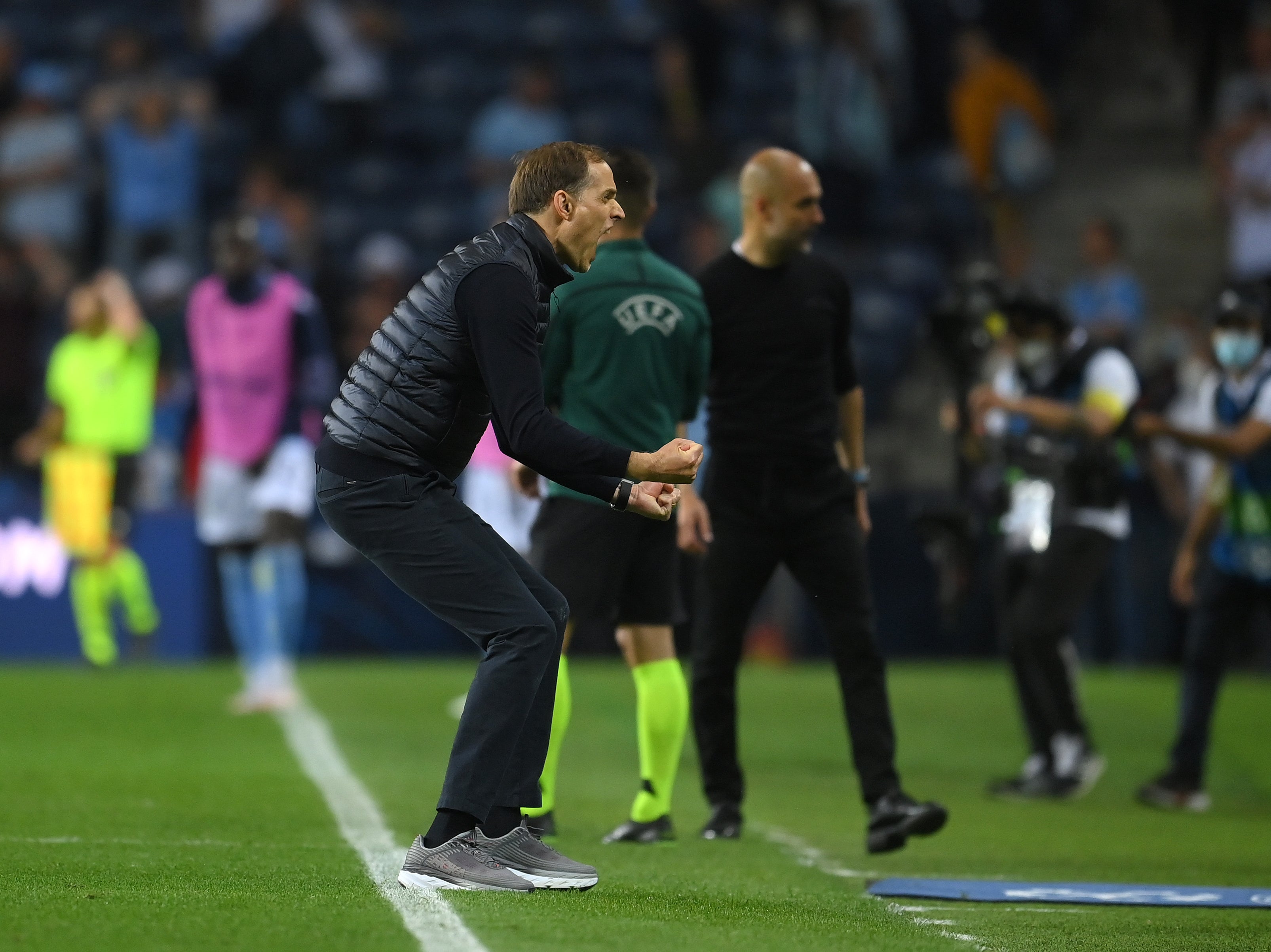 Thomas Tuchel reacts after victory in the Champions League final with Pep Guardiola in the background