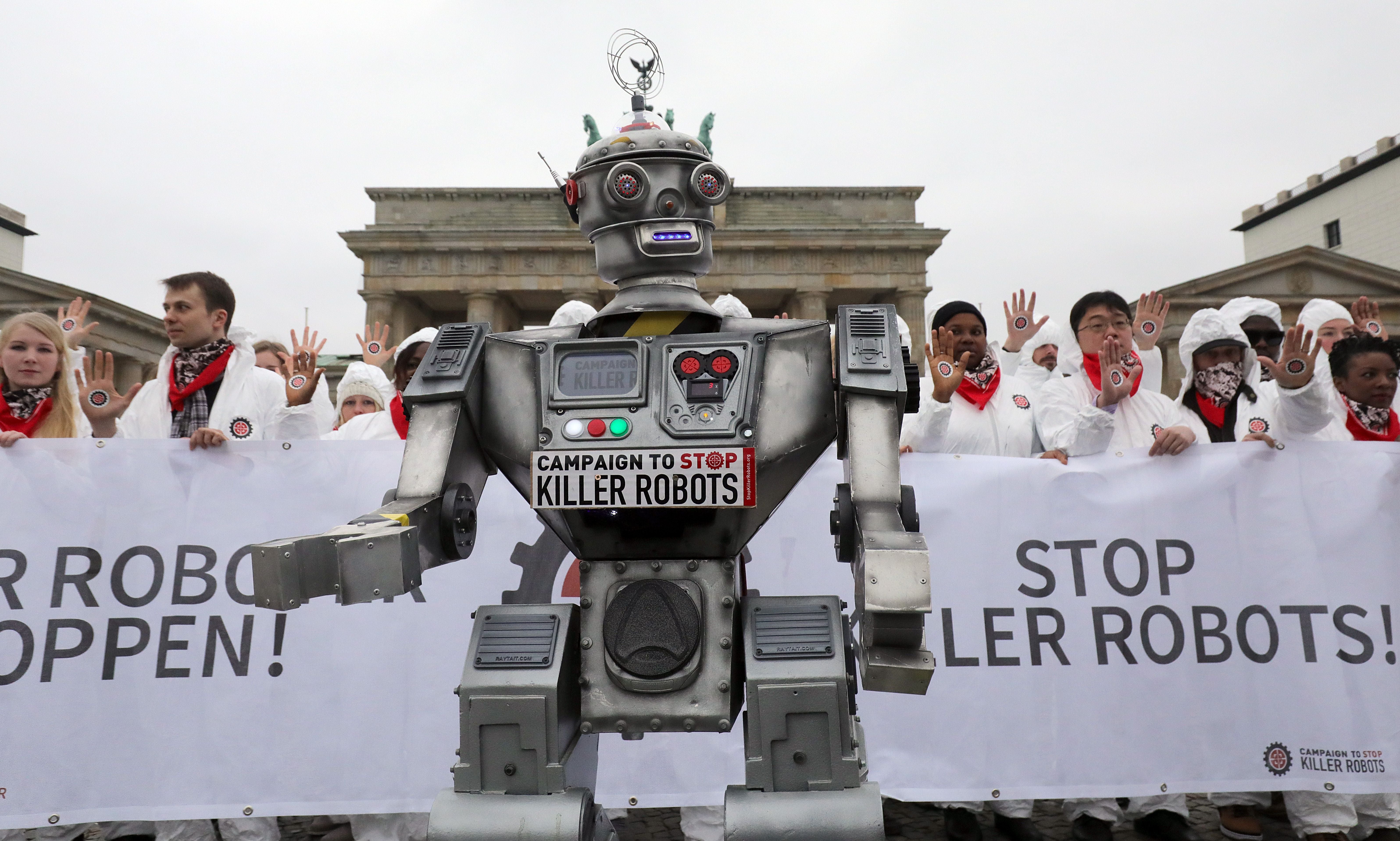 People take part in a demonstration as part of the campaign "Stop Killer Robots" organised by German NGO "Facing Finance" to ban what they call killer robots