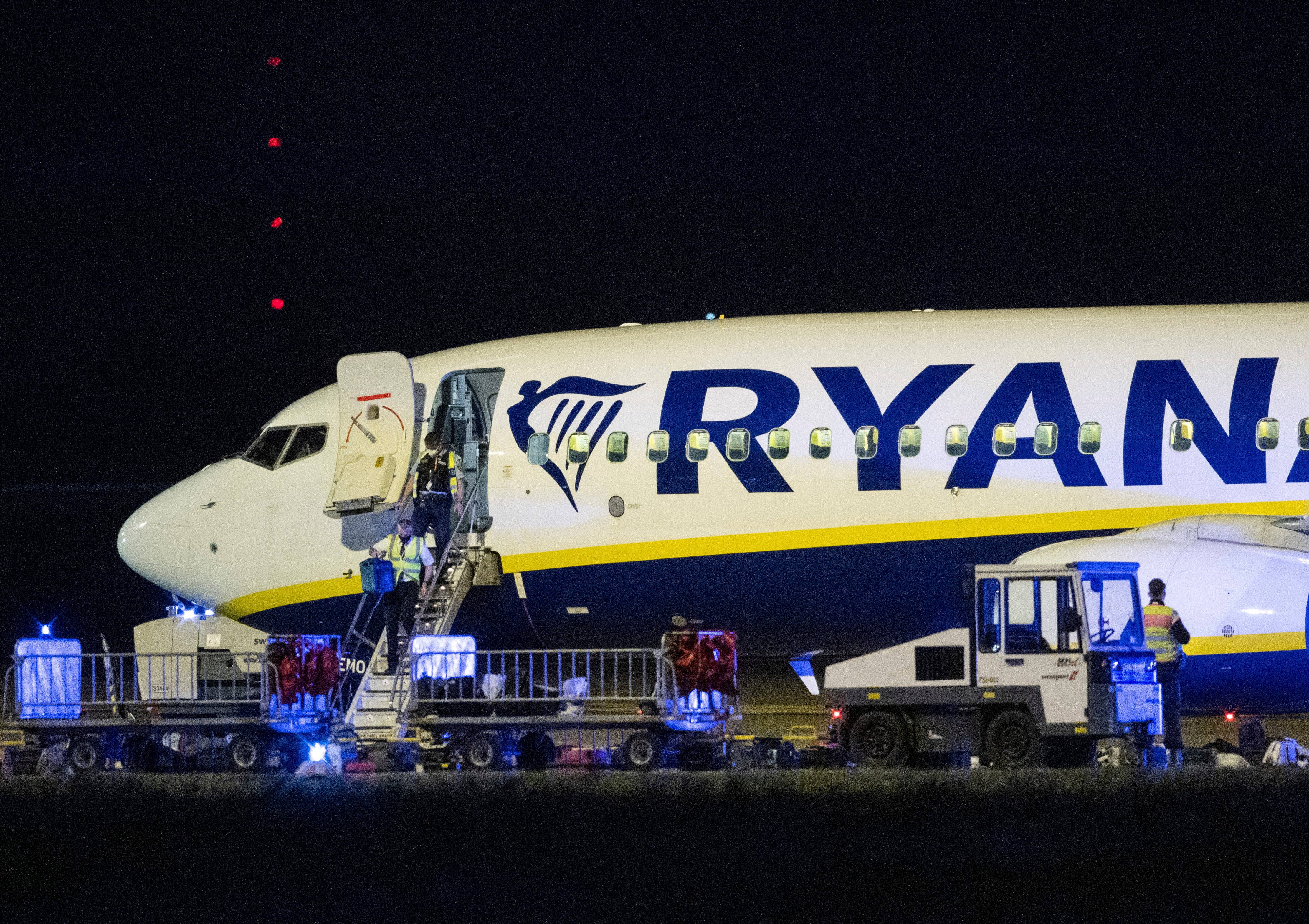 German police inspect a Ryanair aircraft after the unscheduled landing of the plane in Berlin