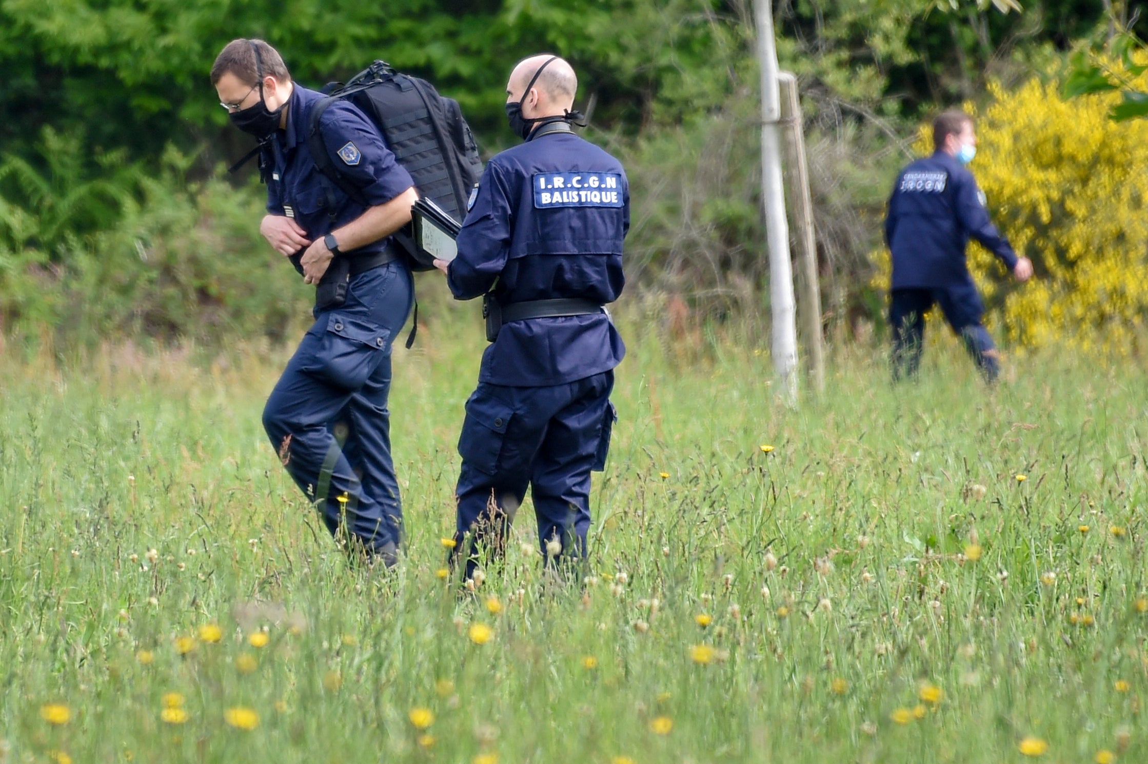 French gendarmes look for evidence in a separate incident near Nantes on 29 May, 2021.