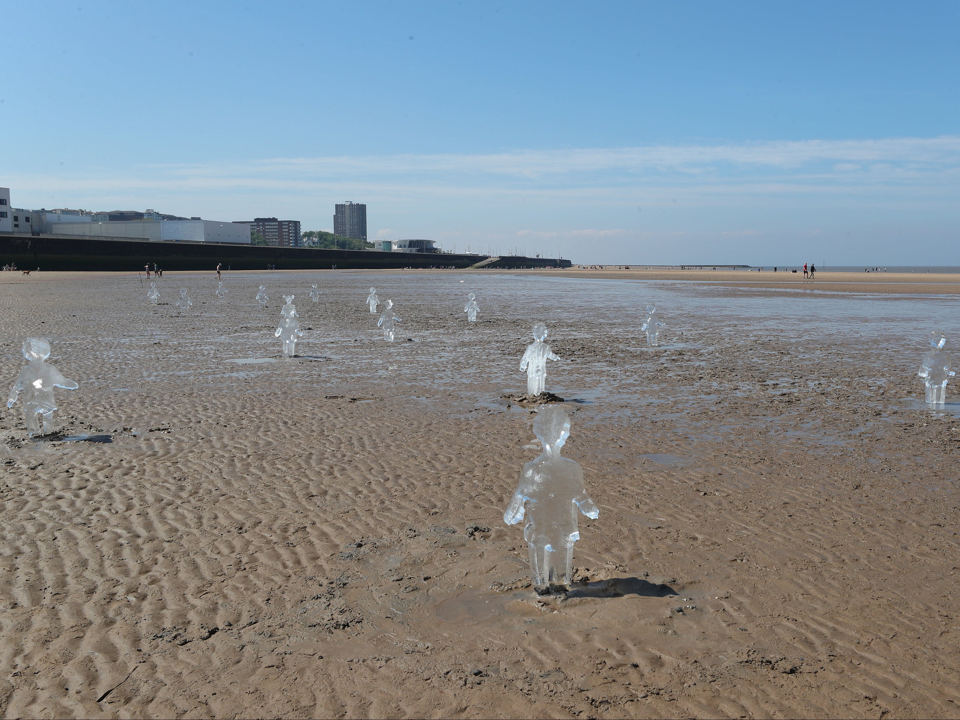 Some of the 26 ice sculptures of children installed on New Brighton beach, Wallasey, in Merseyside