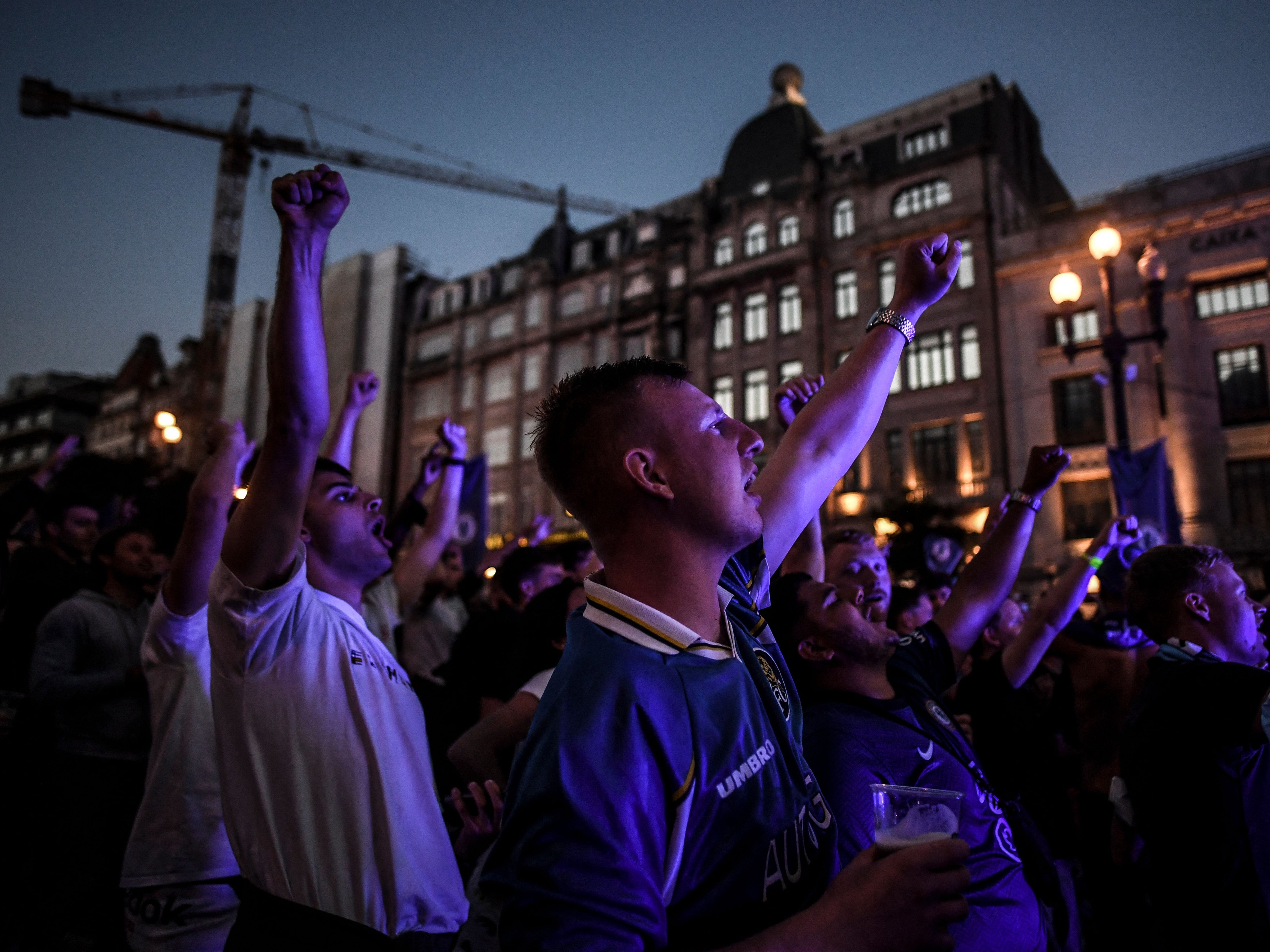 Chelsea supporters react as they watch the UEFA Champions League final football match between Manchester City and Chelsea in a fan zone in downtown Porto