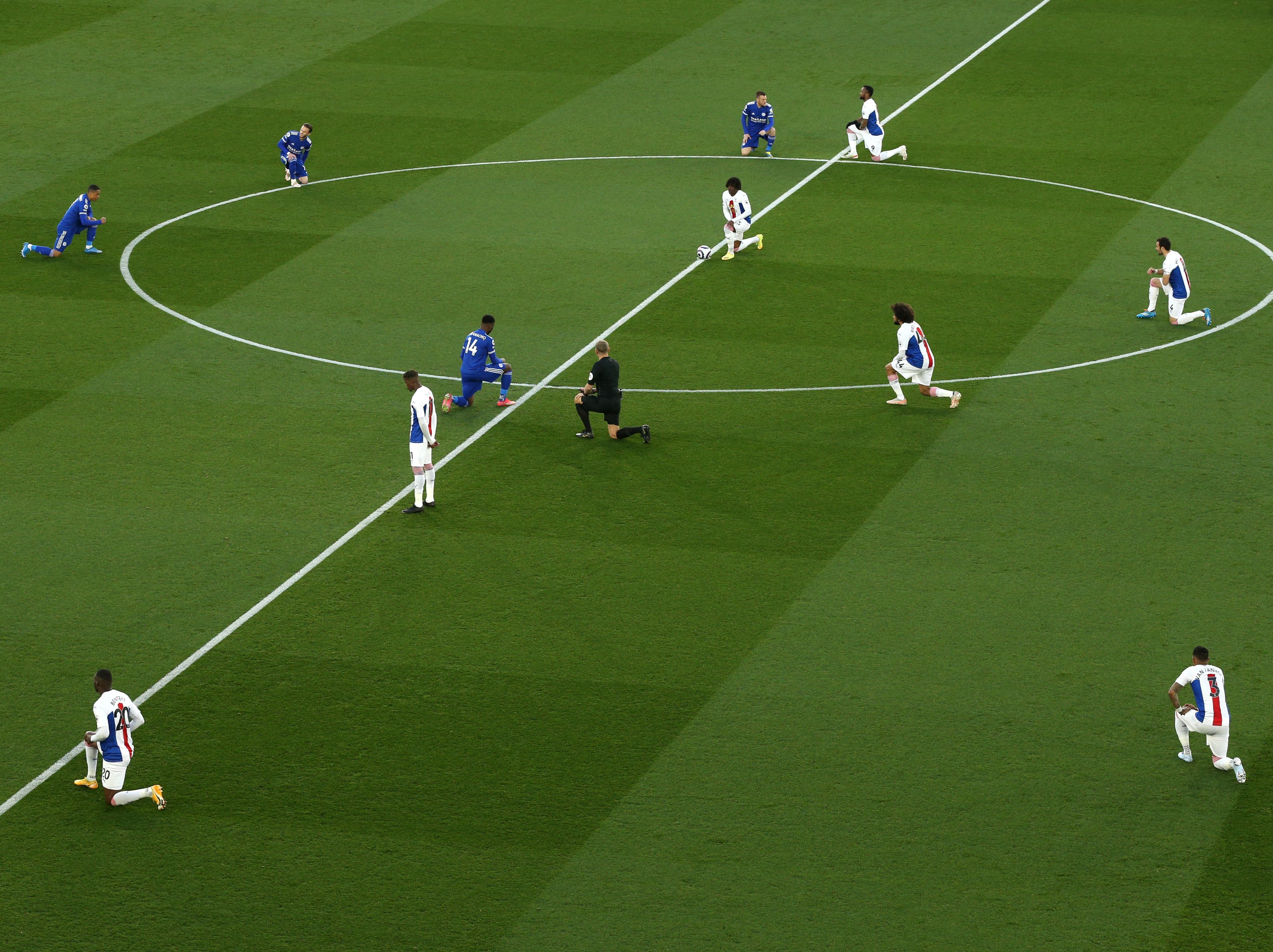 Leicester and Crystal Palace players kneel before kick-off