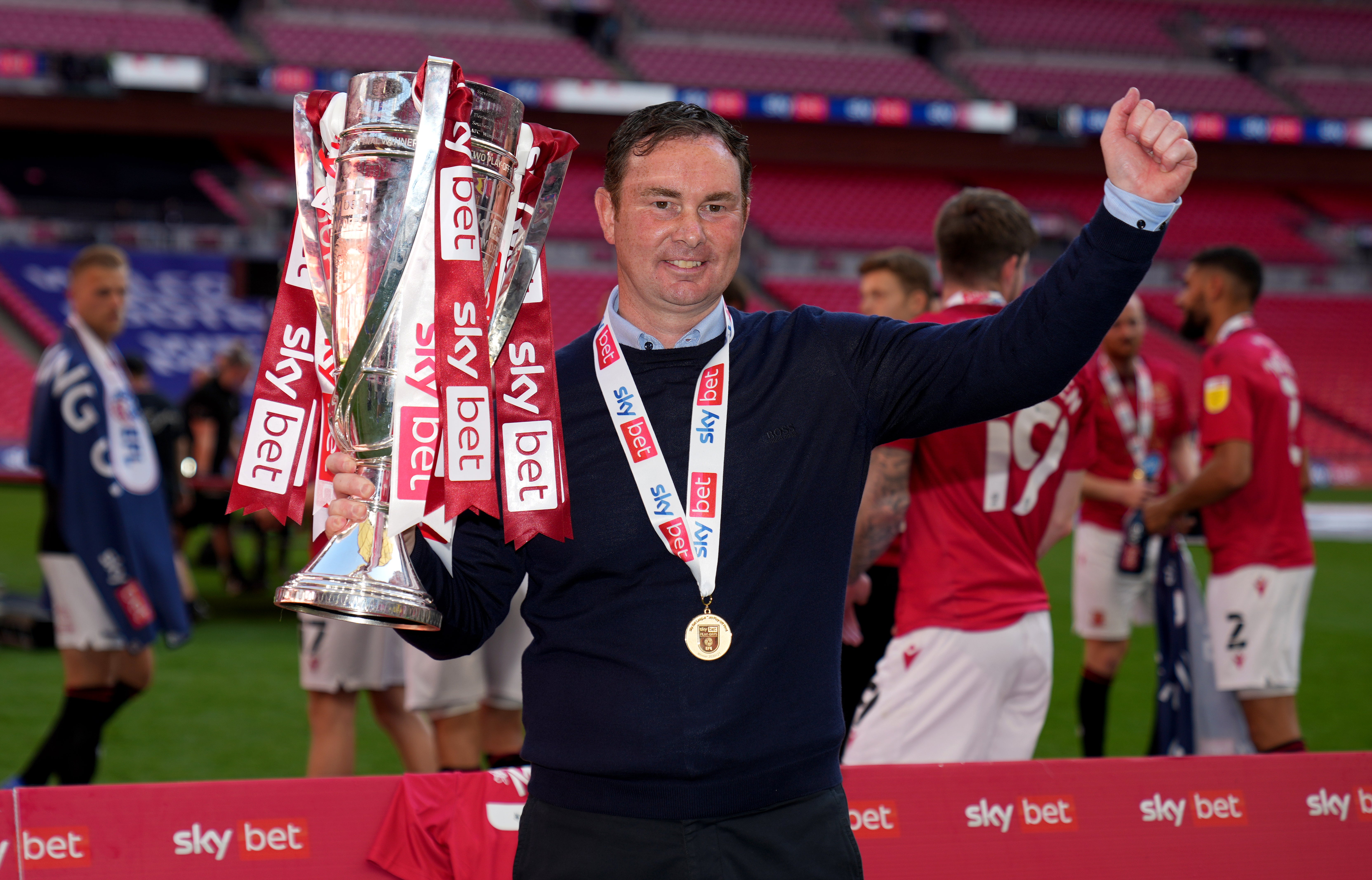 Morecambe manager Derek Adams refused to commit his future to the club after they reached the third tier of English Football for the first time in their history