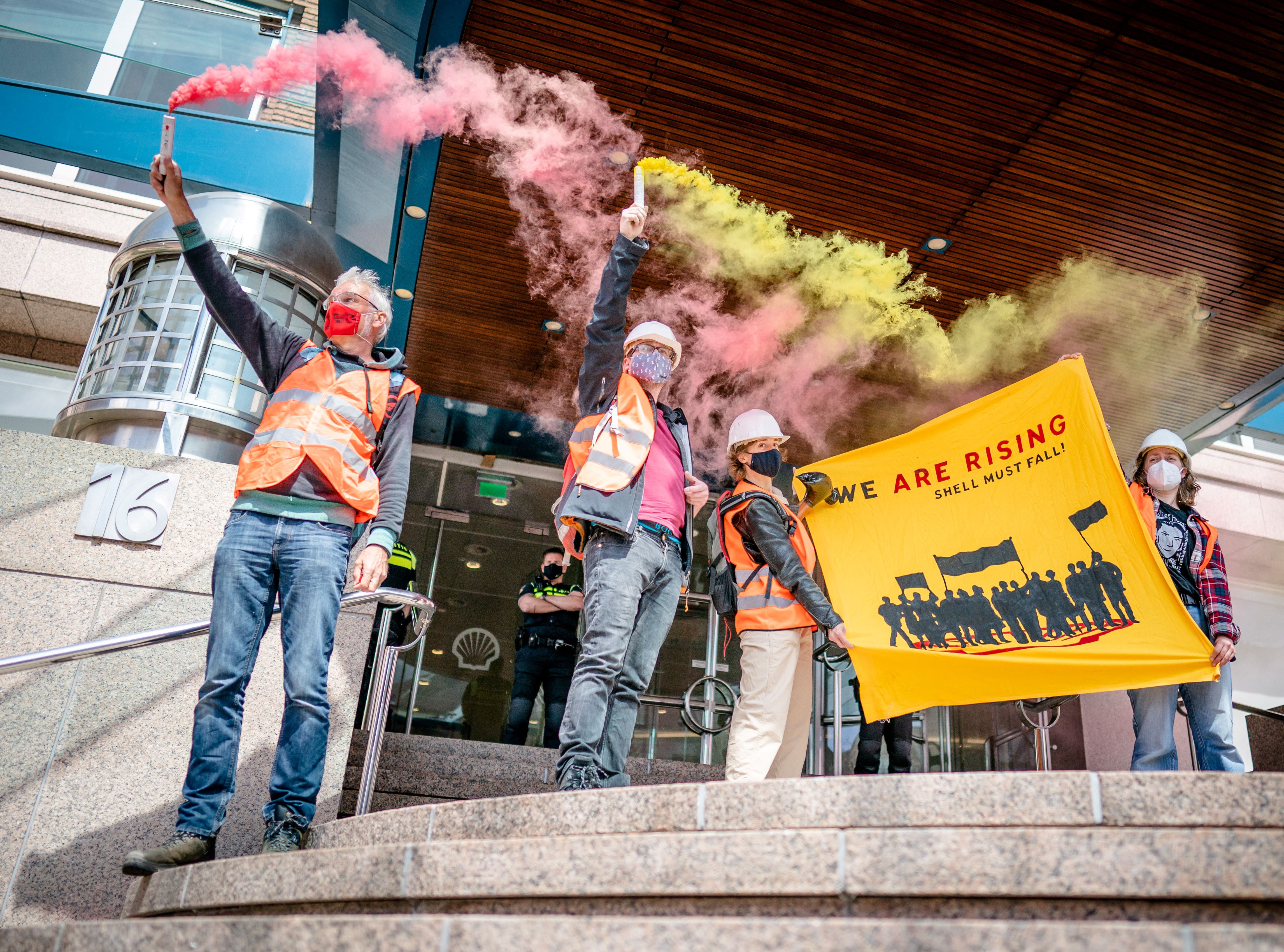 Activists protest outside of Shell’s headquarters in The Hague on 18 May