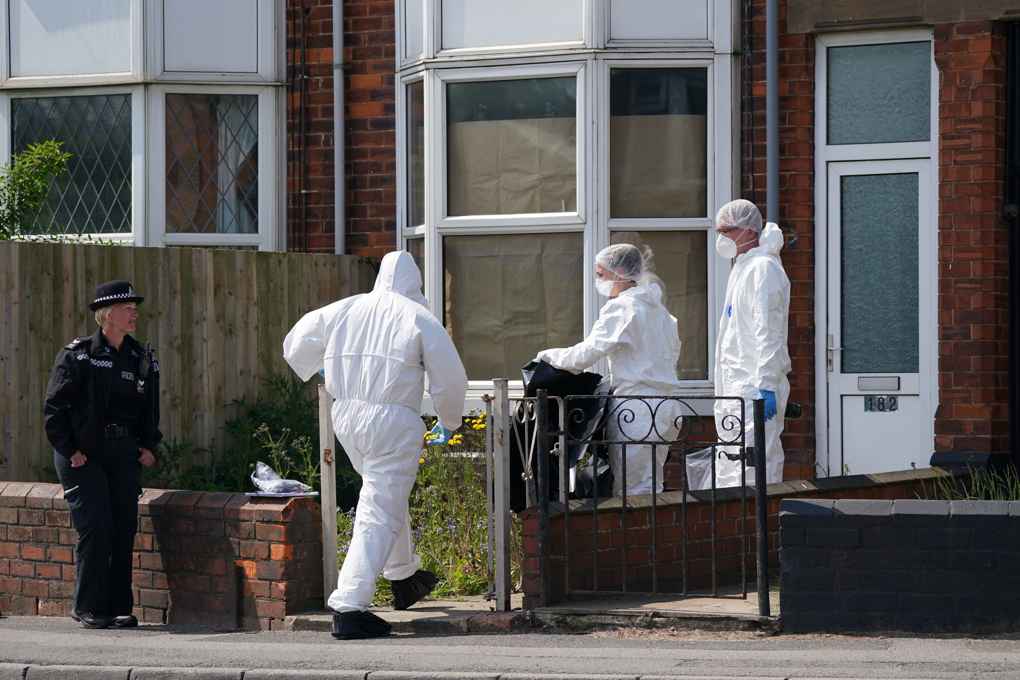 Forensic officers at the scene of Monday’s murder in High Holme Road, Louth