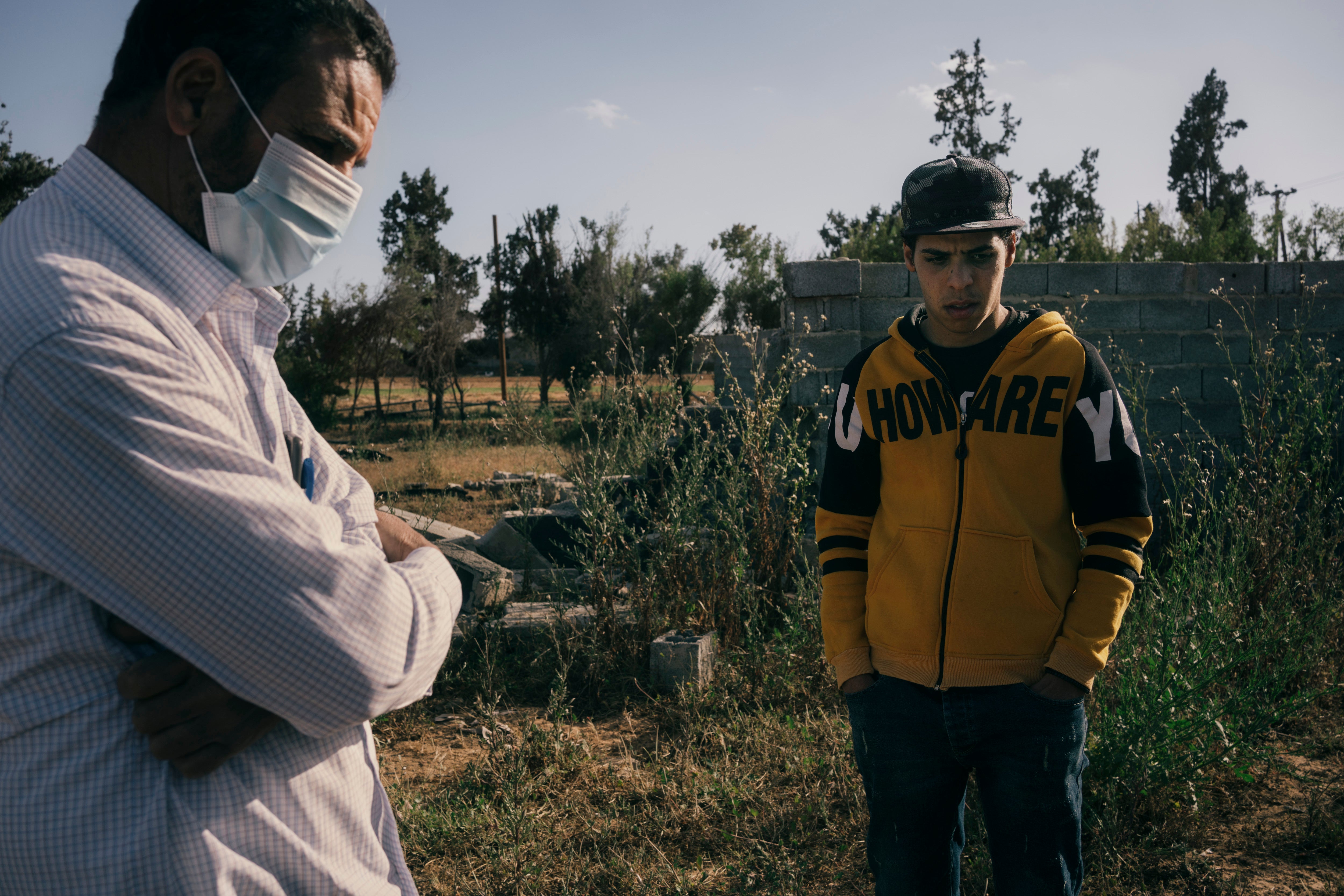 Ali Shama and his son Mahmoud stand on the spot where Abdulrahim died