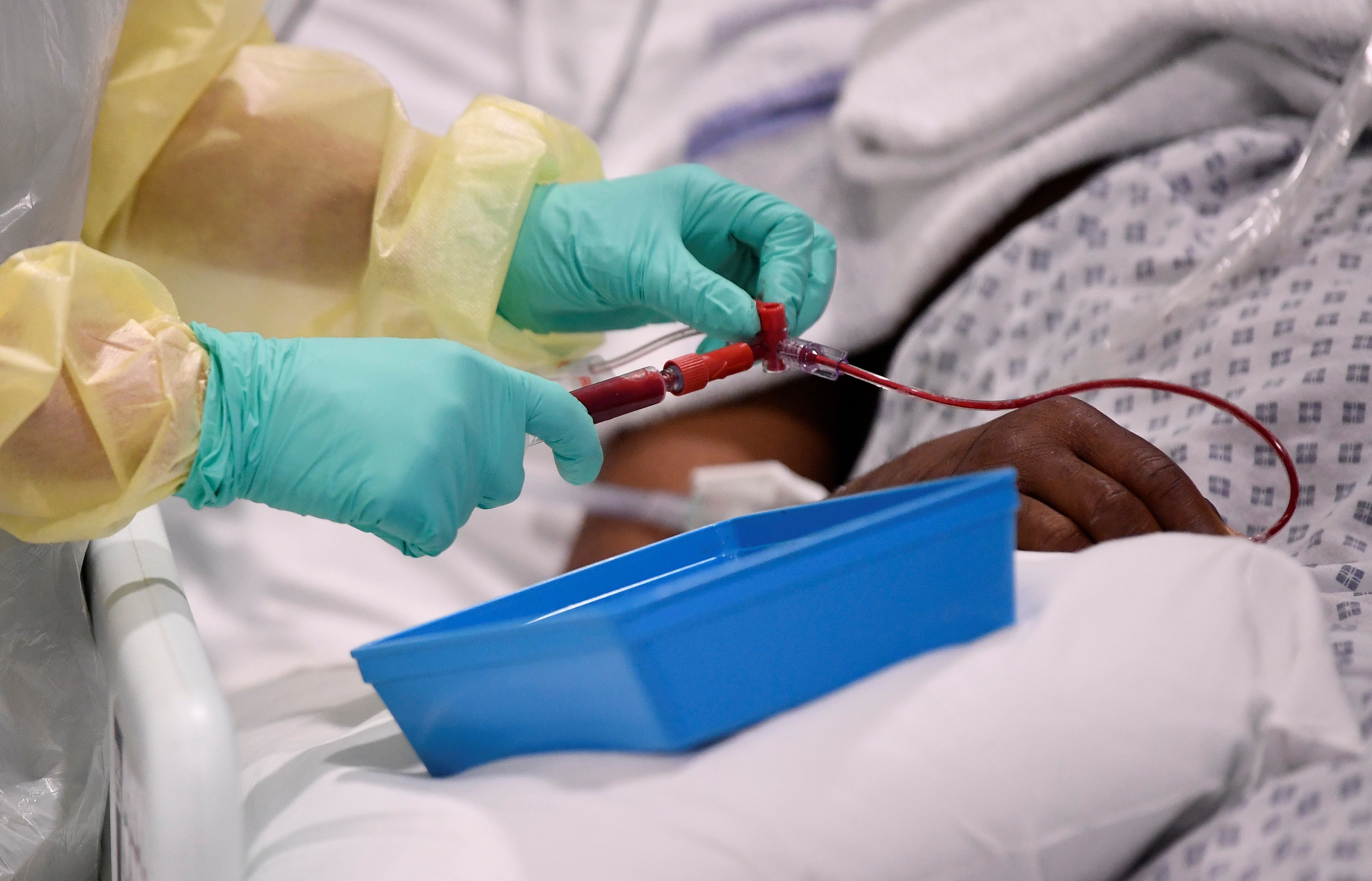 A nurse helps with treatment of a Covid-19 patient in the Intensive Care Unit at Milton Keynes University Hospital