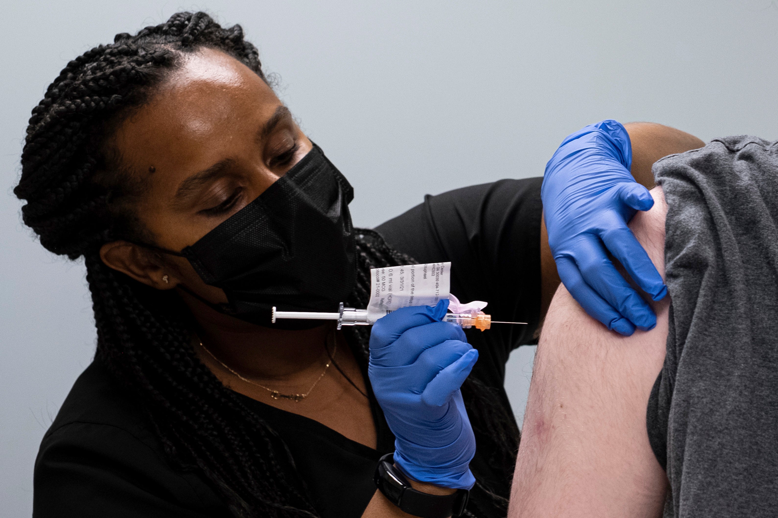 A nurse administers the vaccine