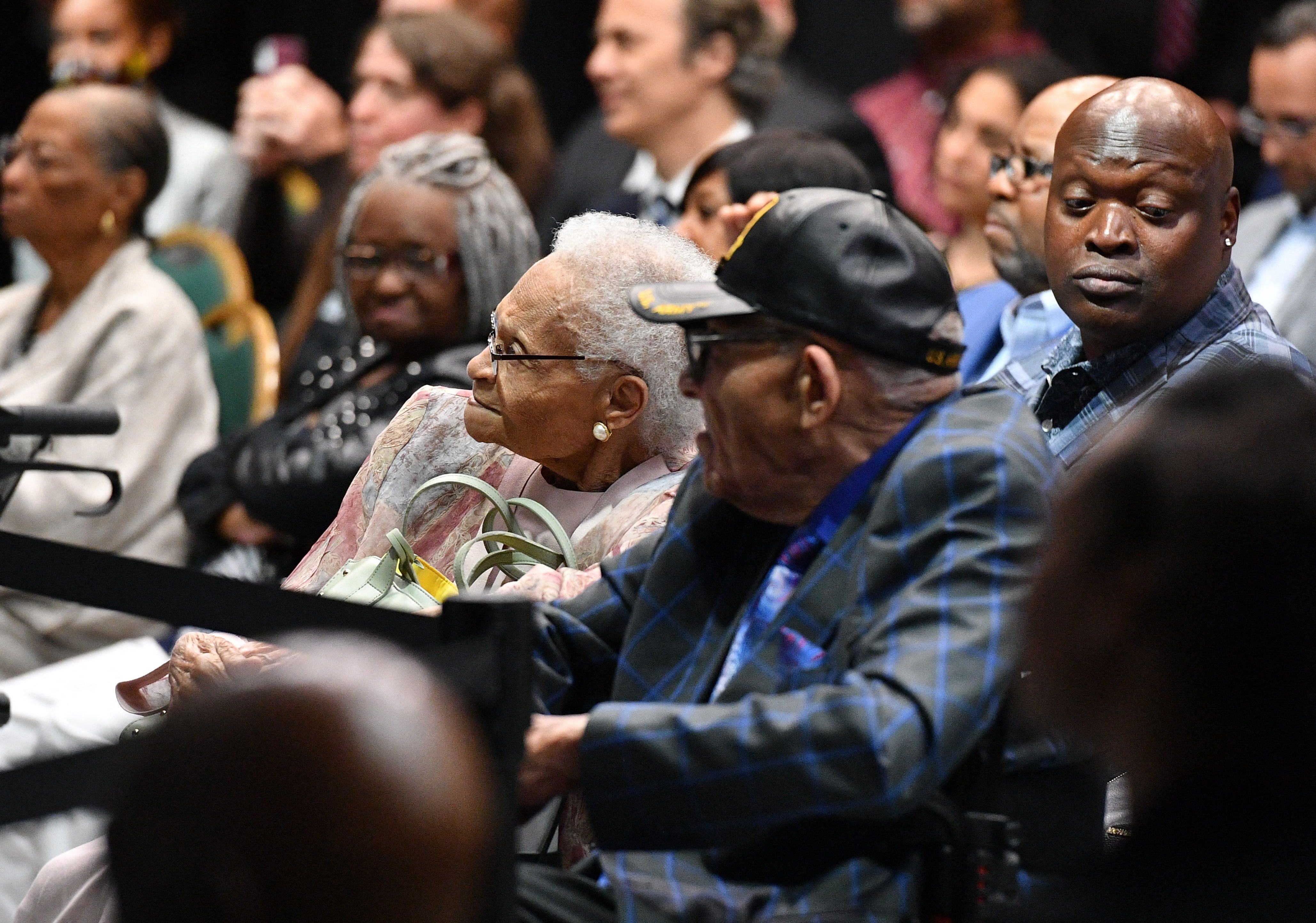 Viola Fletcher and Hughes Van Ellis, two of three living survivors of the 1921 race massacre, listen to Joe Biden speak in Tulsa on 1 June. They are among plaintiffs suing the city and Oklahoma for reparations.