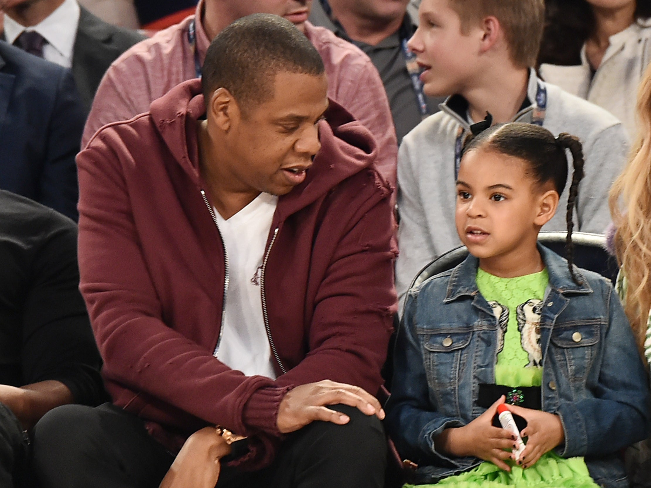 Jay Z and daughter Blue Ivy Carter attending the 66th NBA All-Star Game in 2001