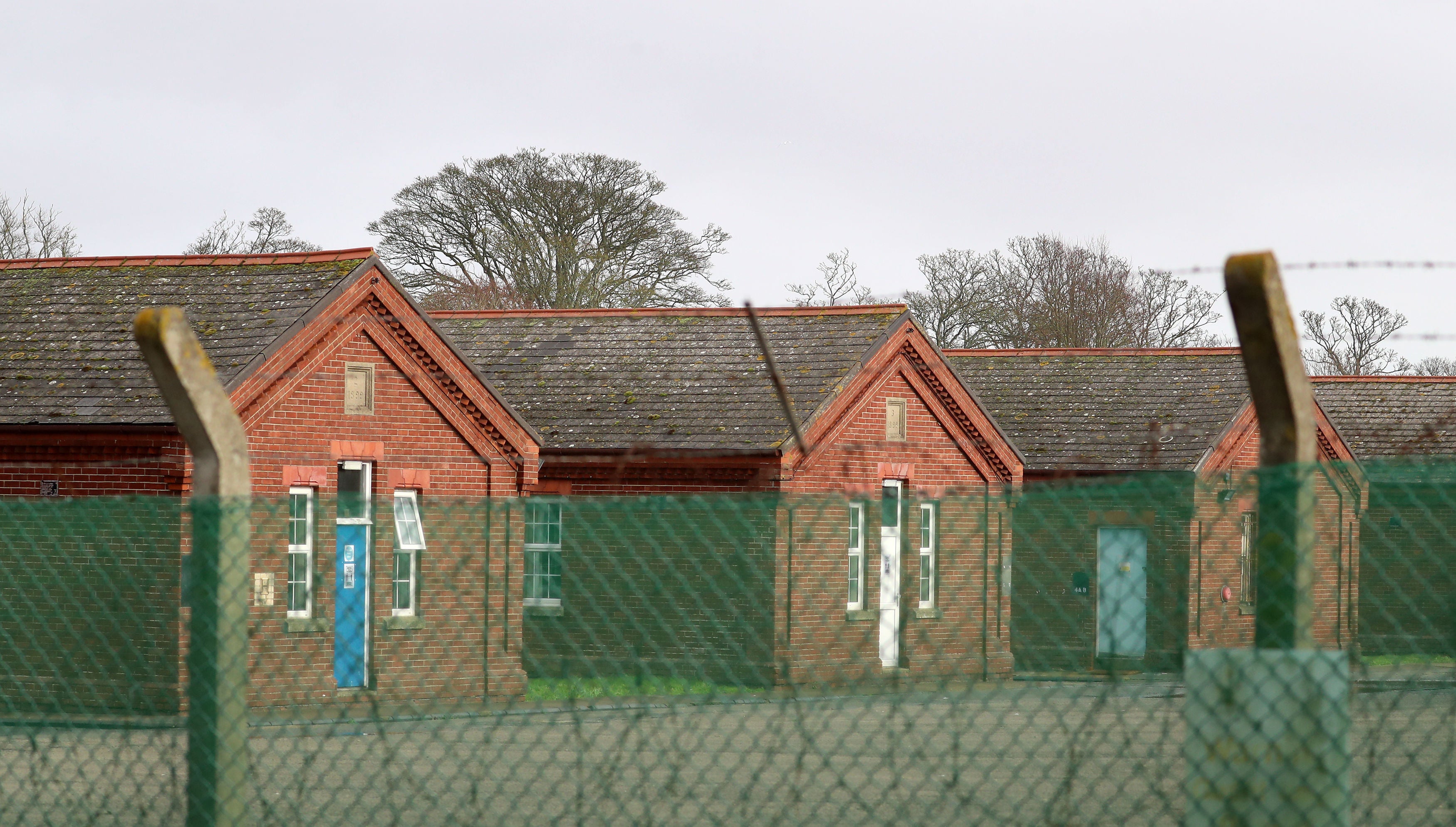 Health bodies warned that housing hundreds of people in dormitory-style accommodation was unsafe