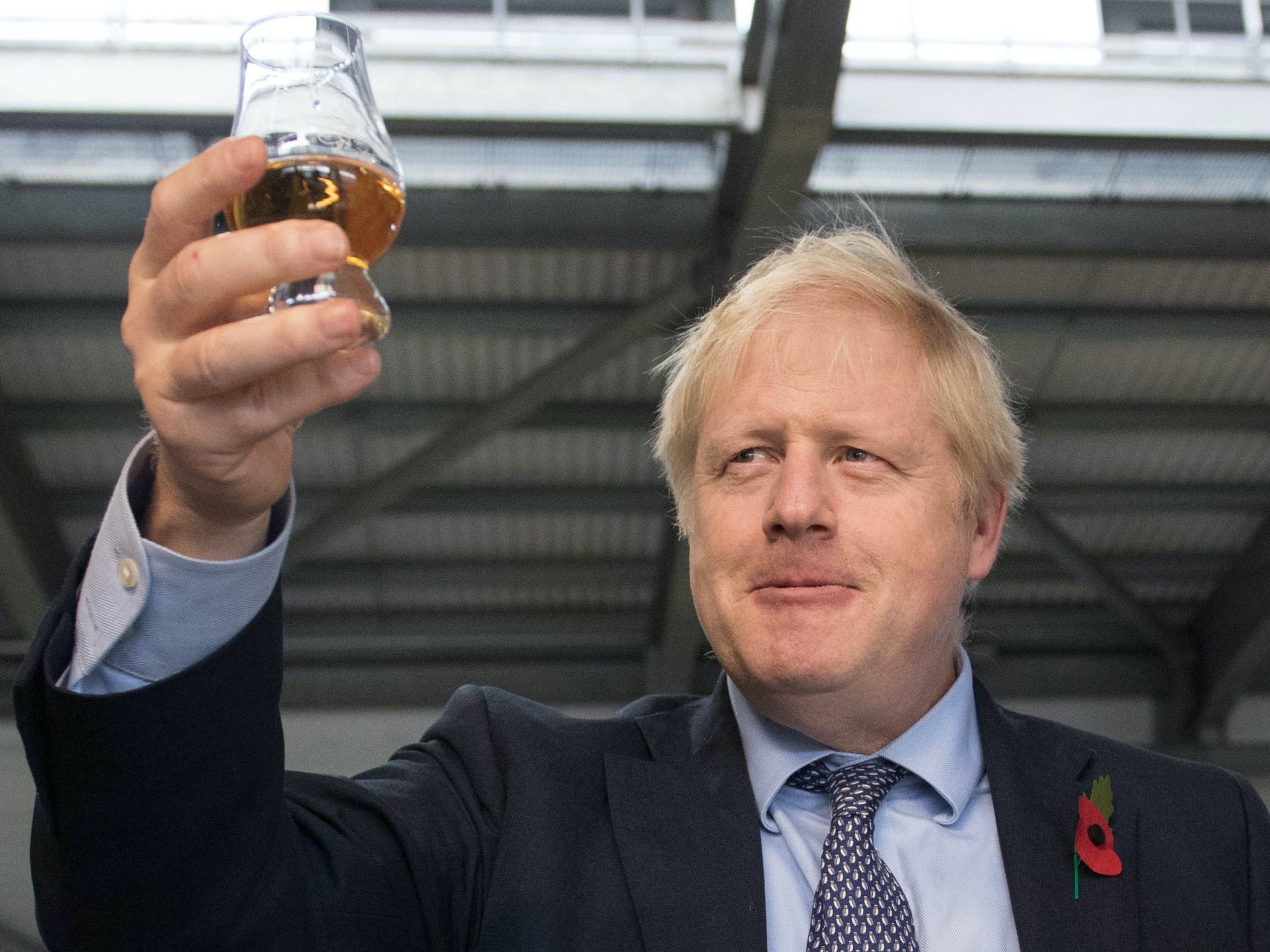 Boris Johnson tastes whisky at a distillery