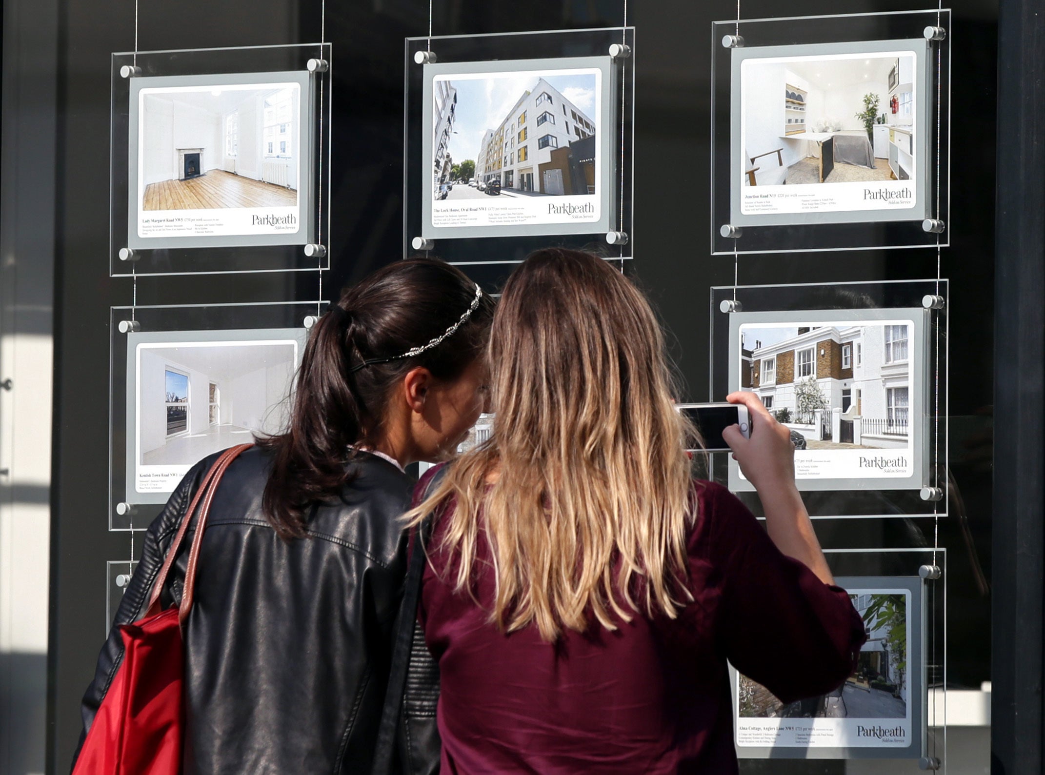 Women at an estate agent's window