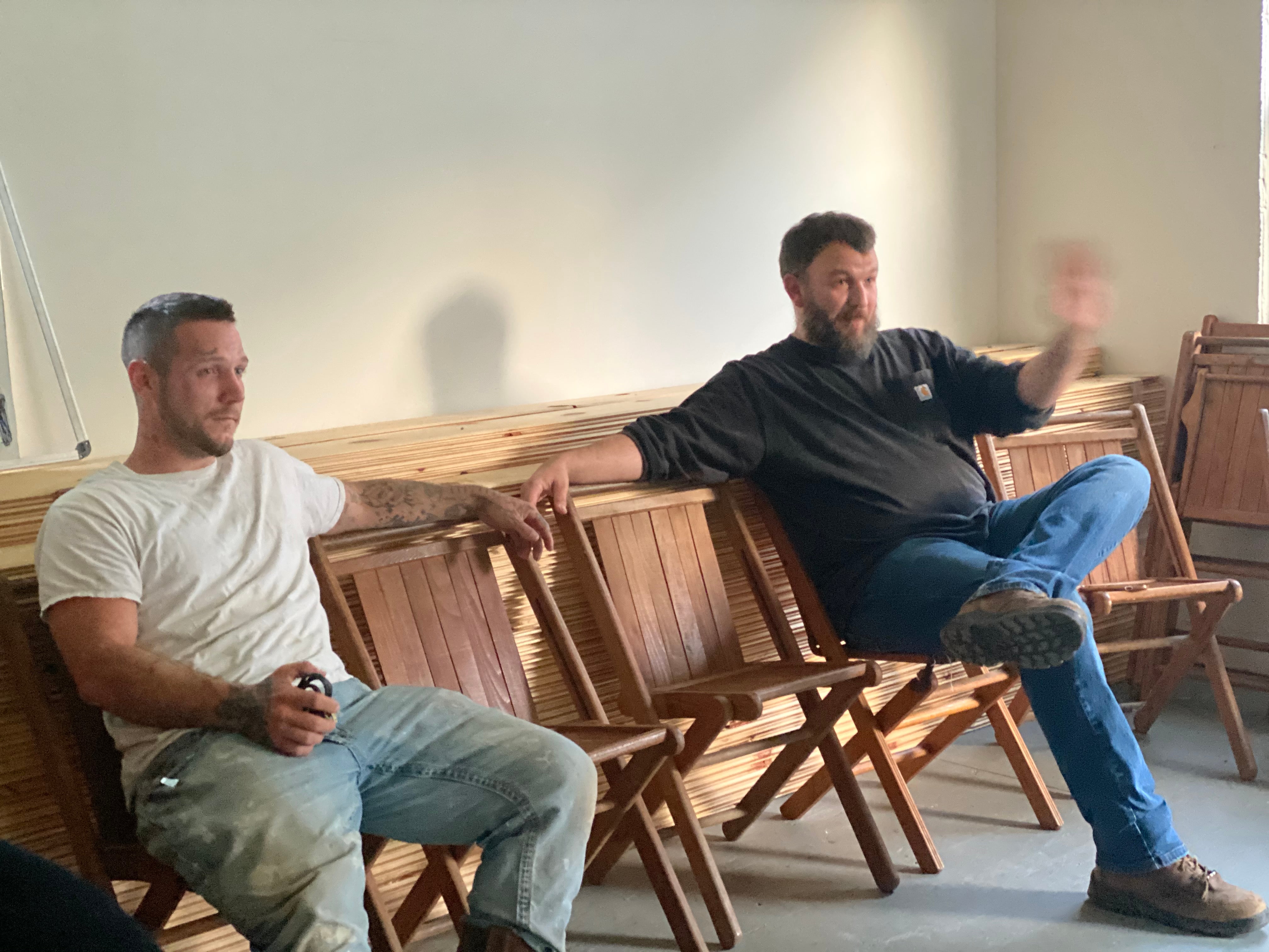 Alex Davis, 27, sits alongside pastor Daniel Adkins