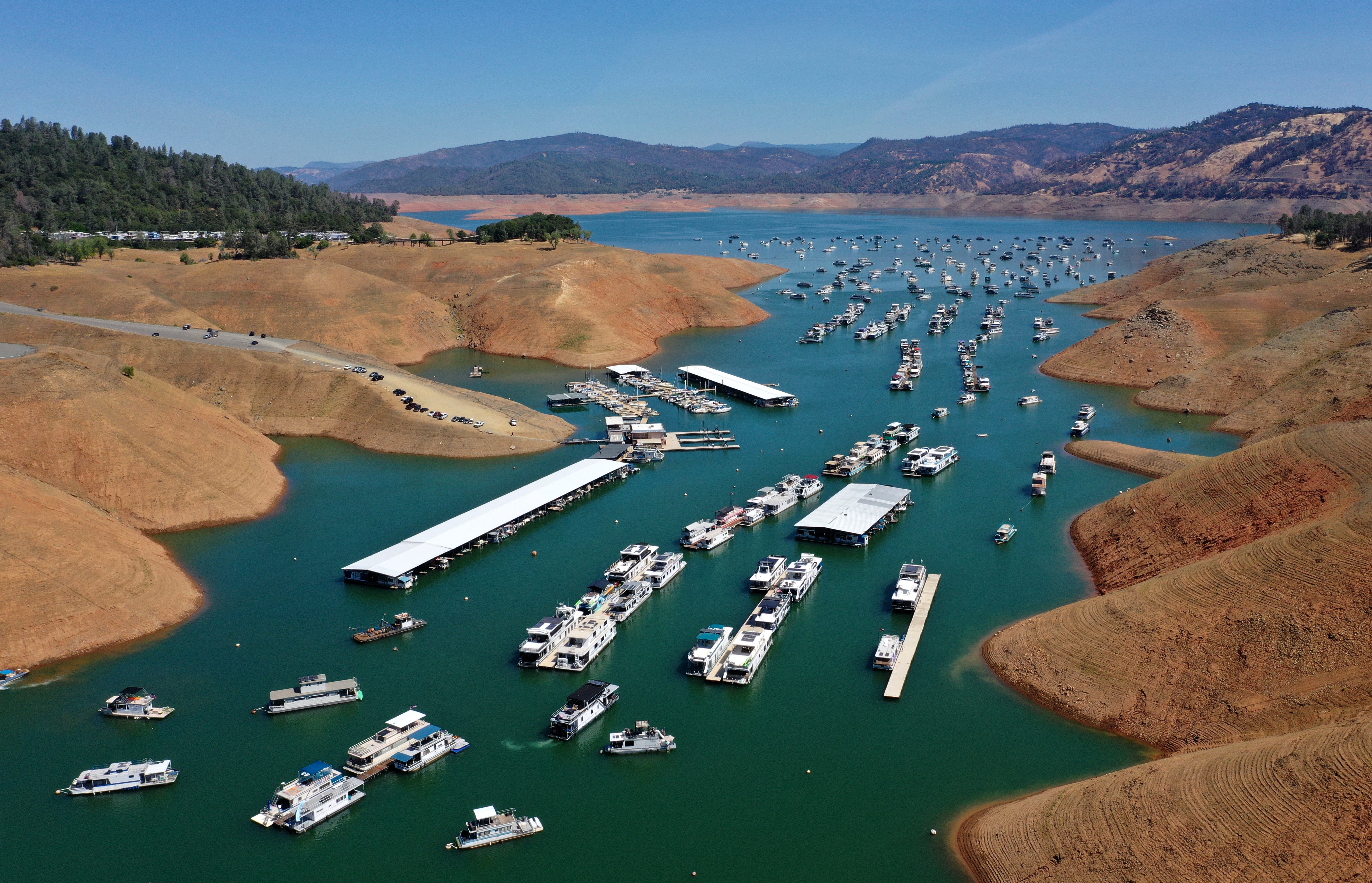 In an aerial view, houseboats sit anchored at the Bidwell Canyon Marina on Lake Oroville on 1 June 2021 in Oroville, California