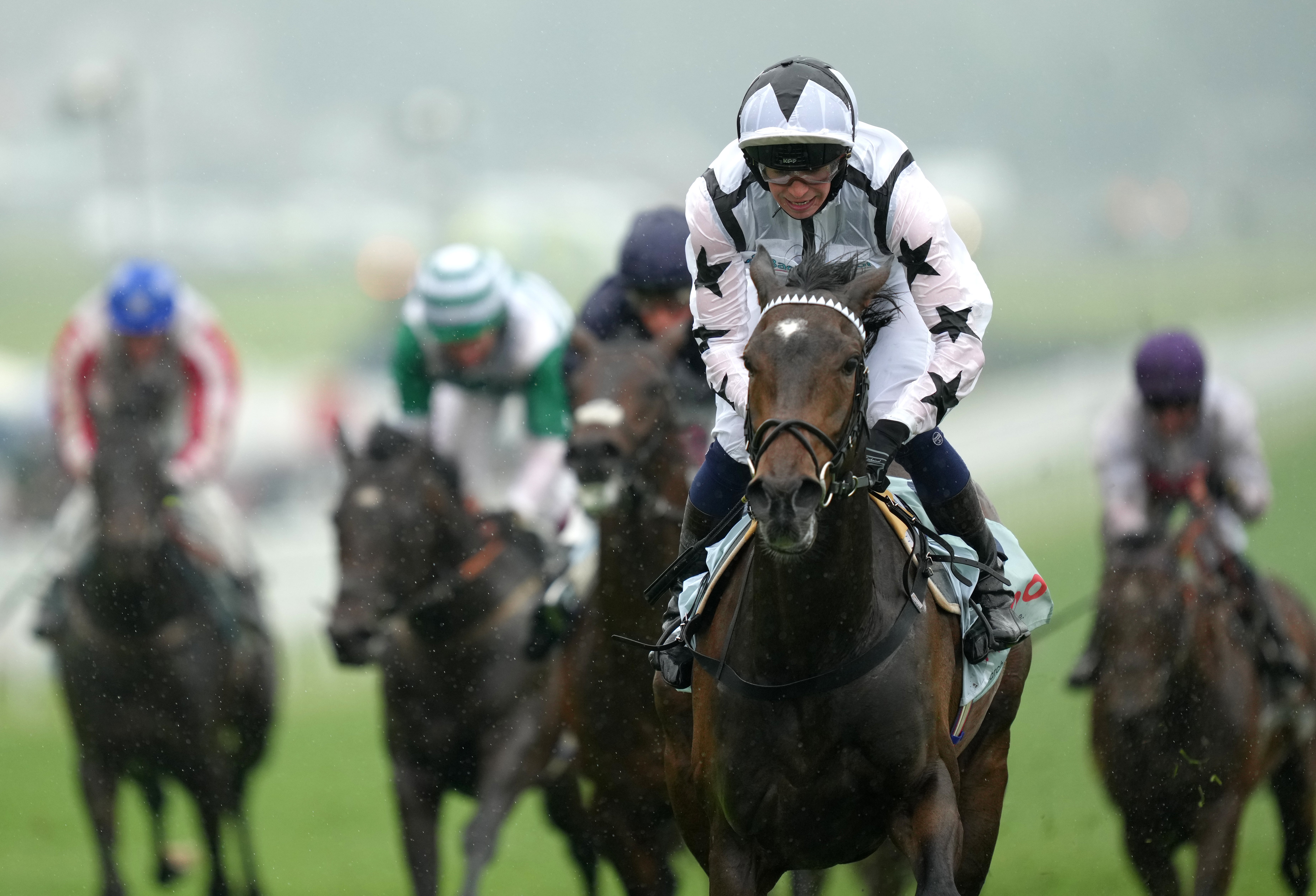 Oscula wins the Woodcote Stakes at Epsom