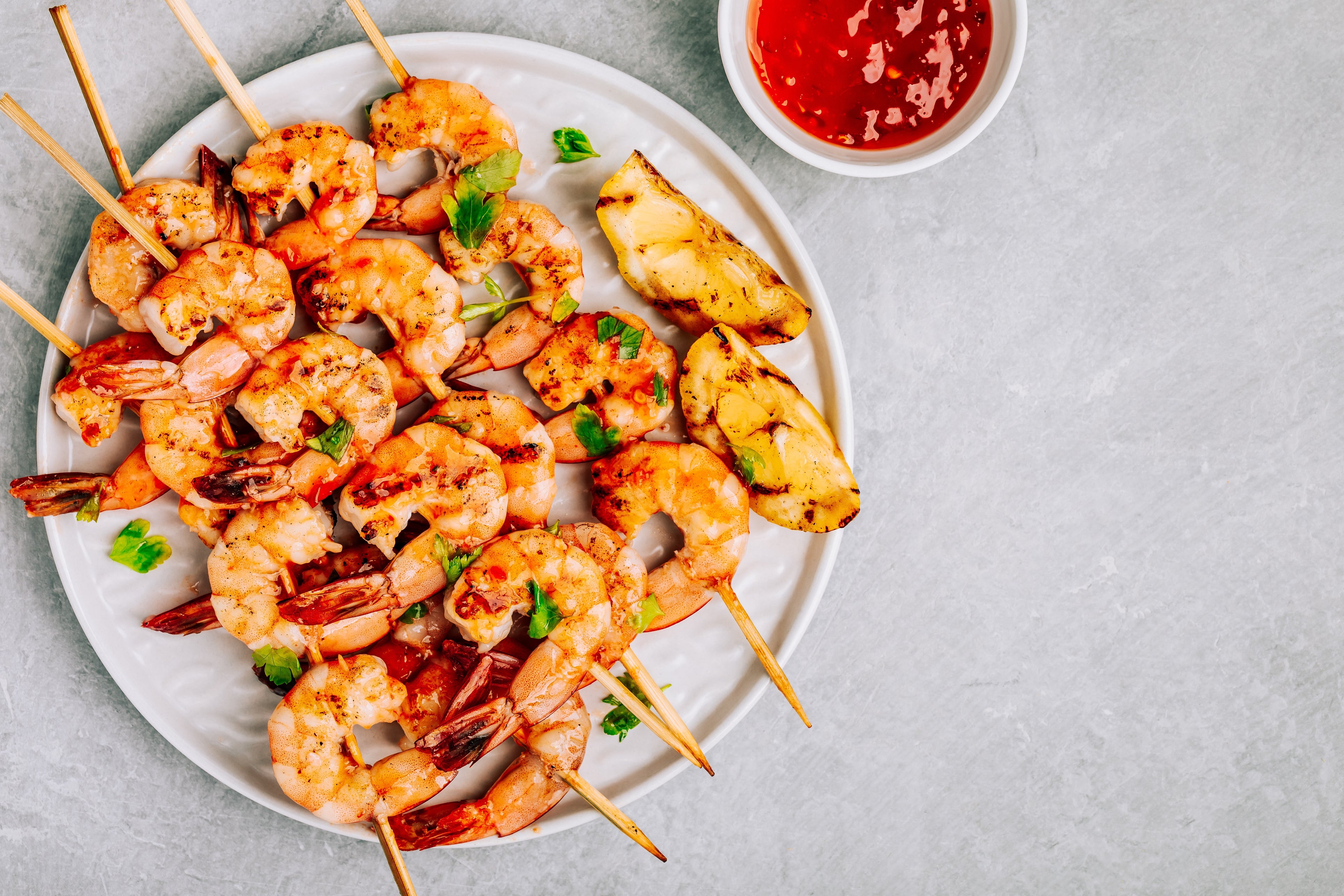 The prawns and vegetables all benefit from a dip in a piquant red pepper sauce that takes cues from the Catalan romesco