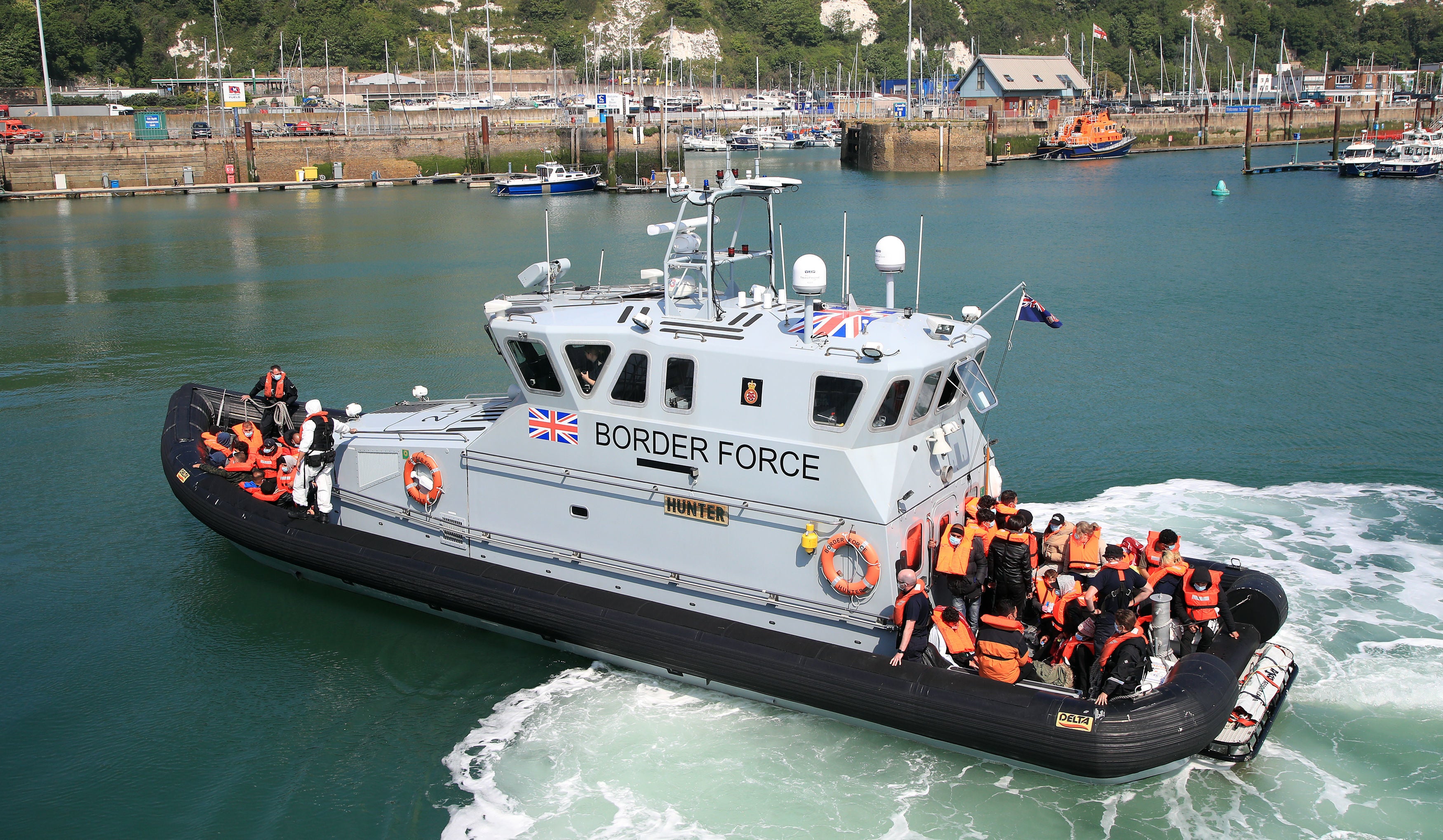 A different group of migrants is brought to Dover by Border Force on Thursday