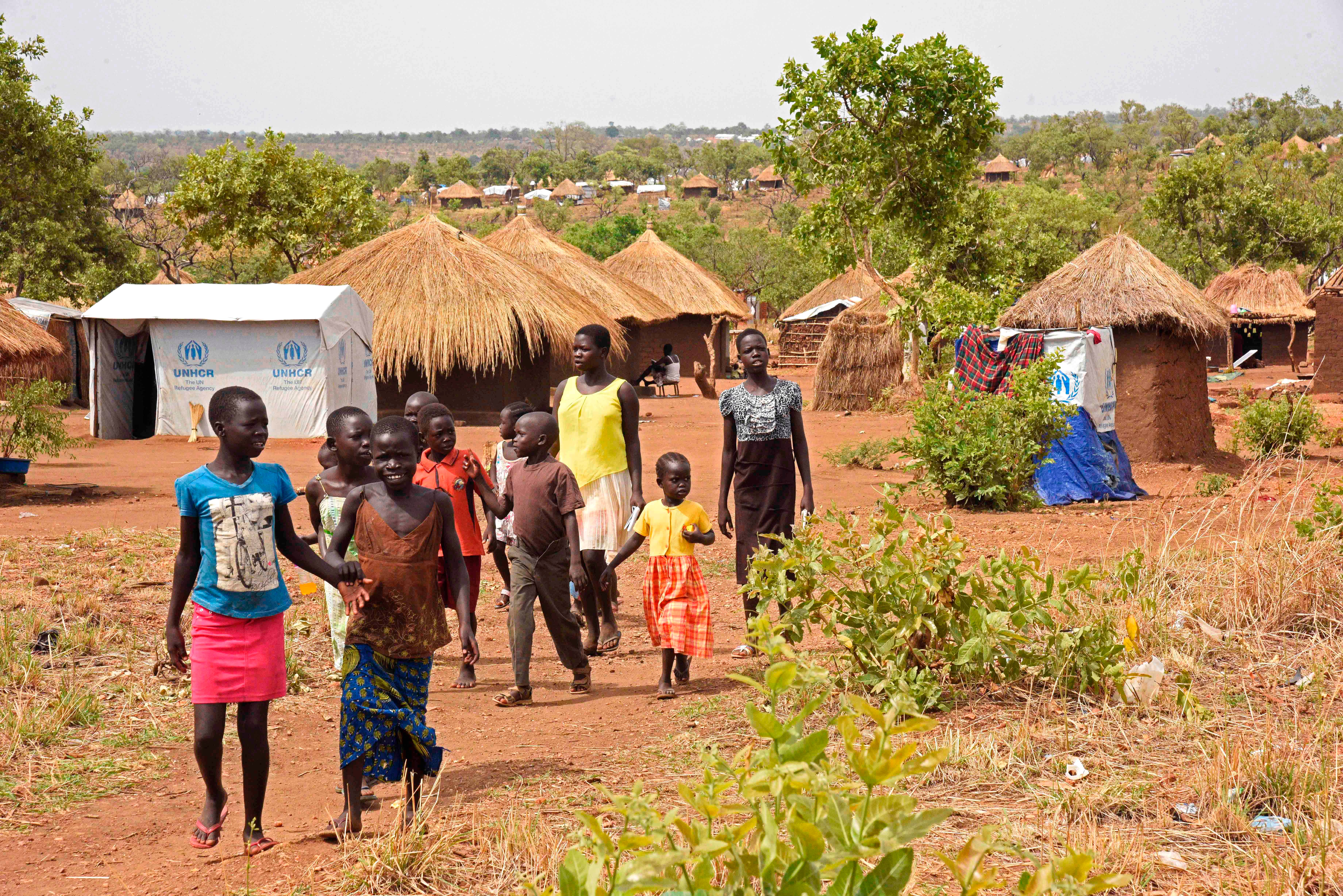 Refugee children from South Sudan stroll through the Bidibidi Resettlement Camp