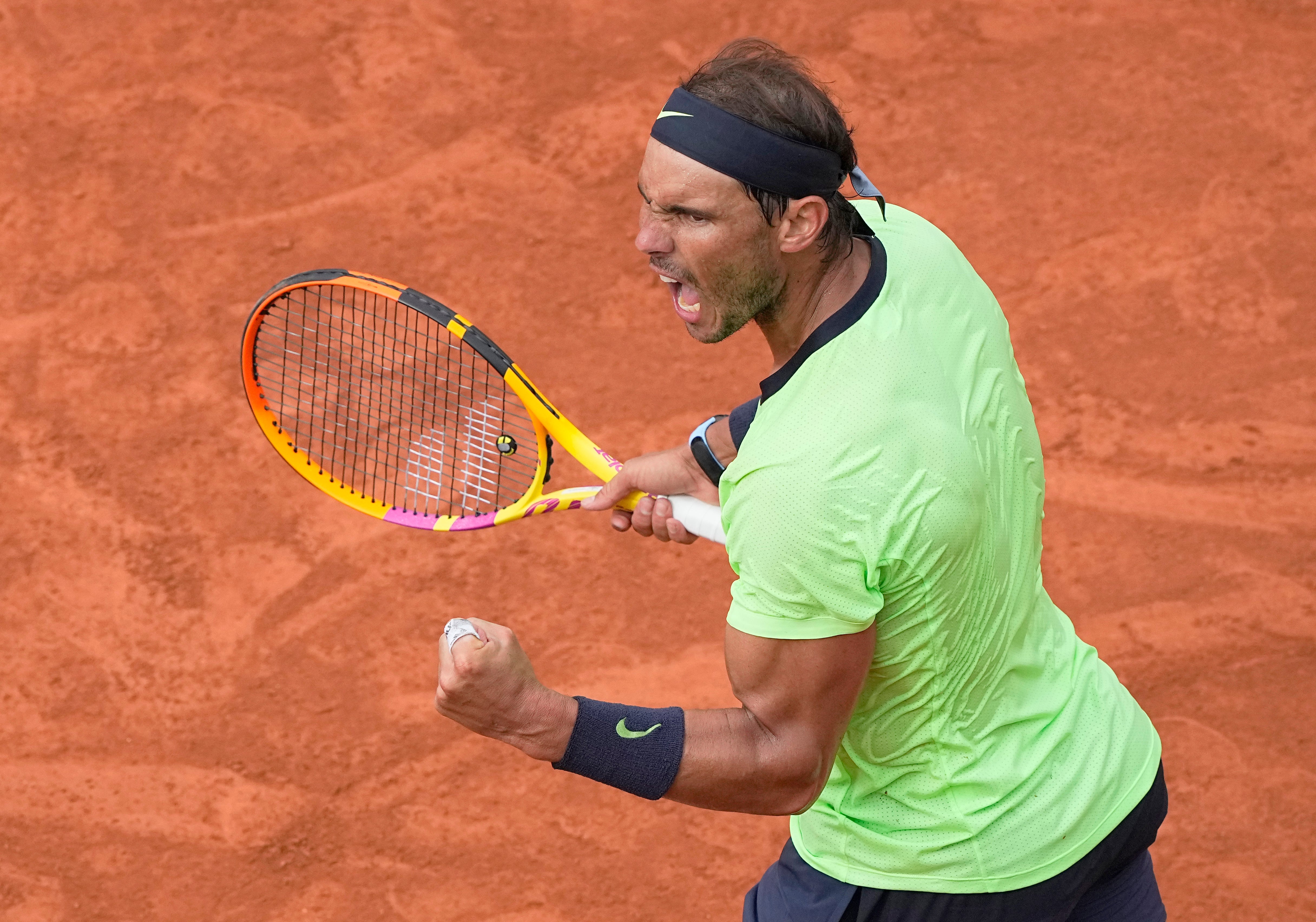 Rafael Nadal celebrates winning an important point