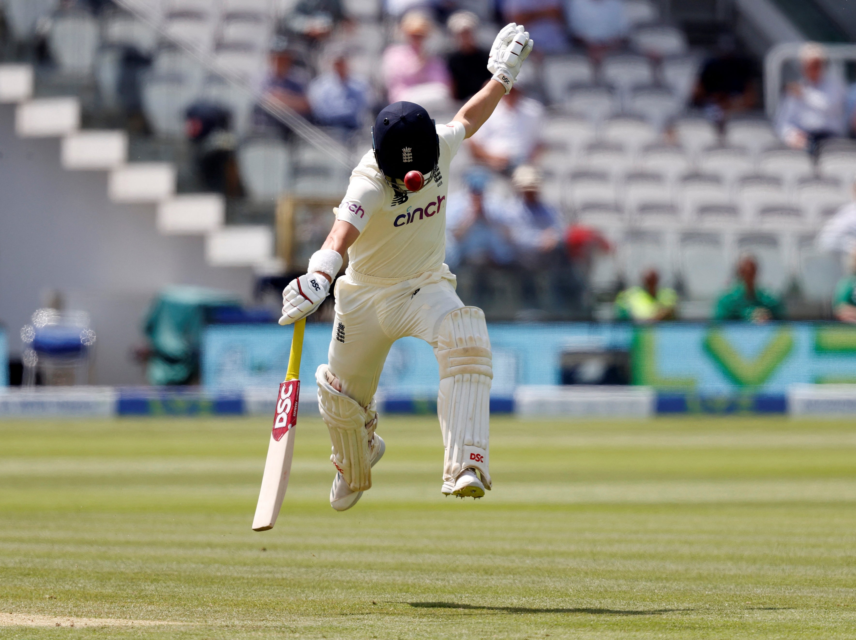 Rory Burns is struck by the ball while running back to his crease