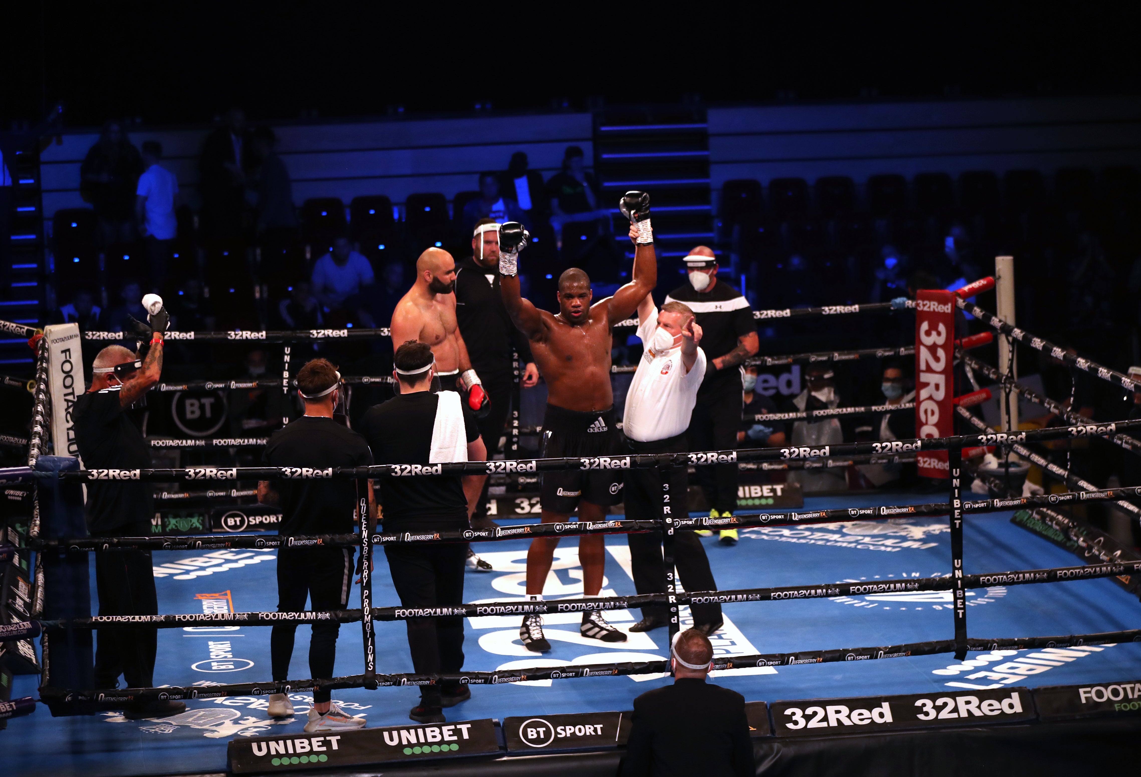 Daniel Dubois celebrates victory Romania's Bogdan Dinu