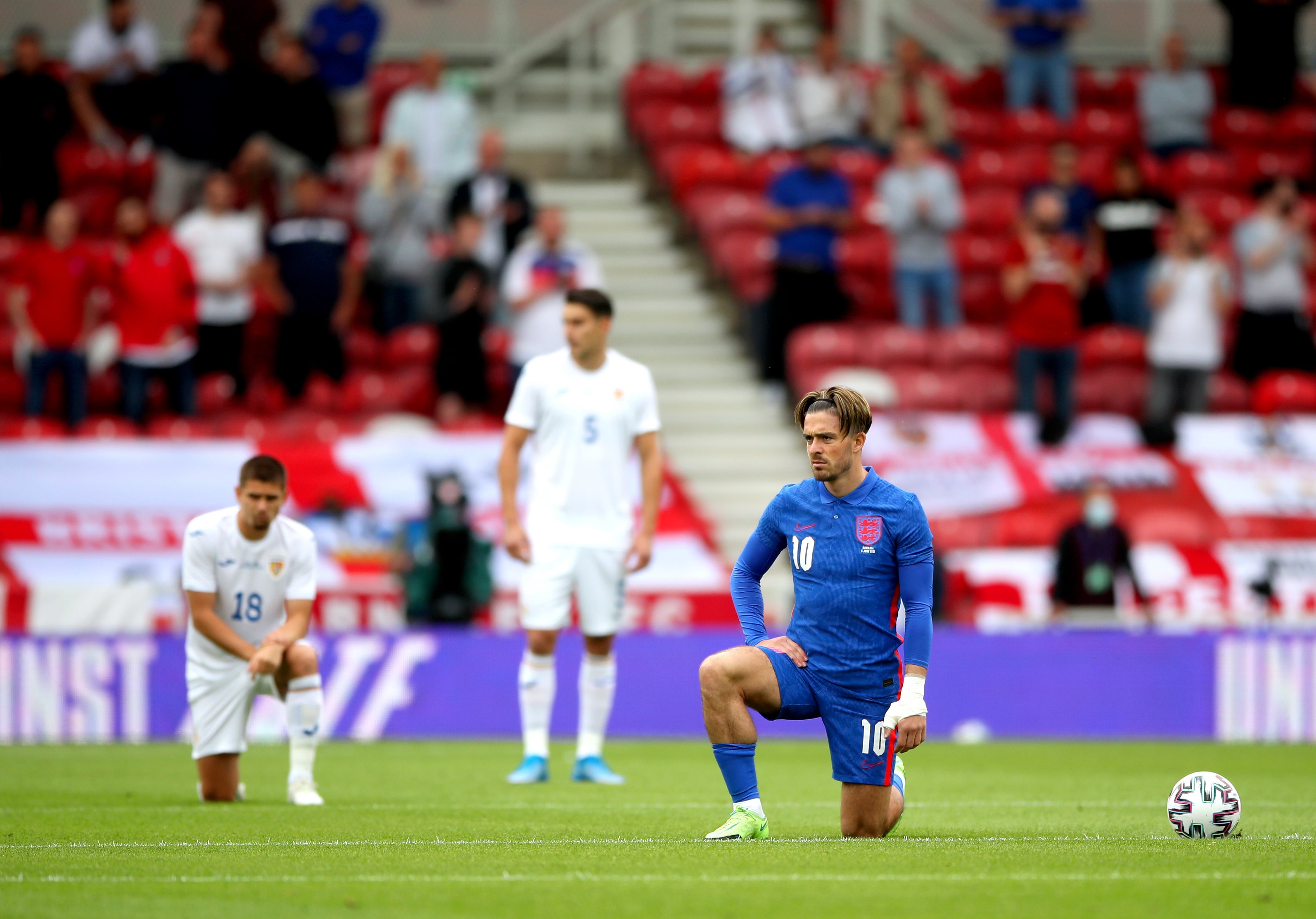 England’s Jack Grealish takes a knee before their European Championship warm-up match with Romania at Riverside Stadium