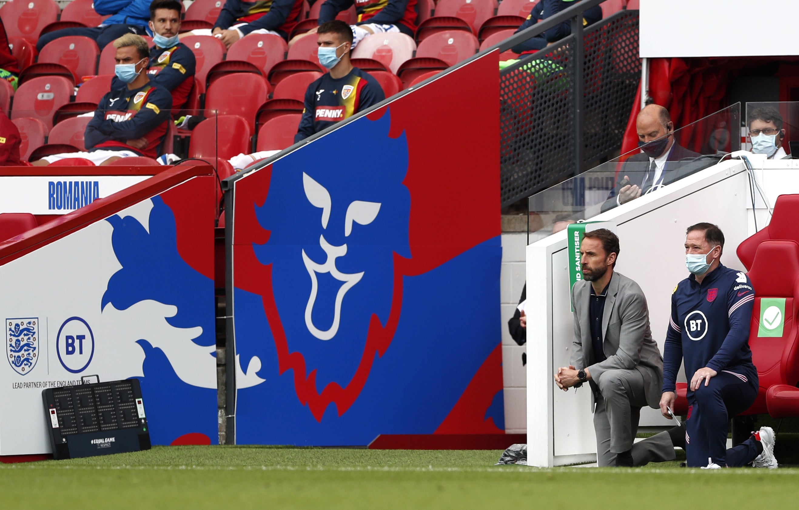 Gareth Southgate and his coaching staff take the knee ahead of Euro 2020