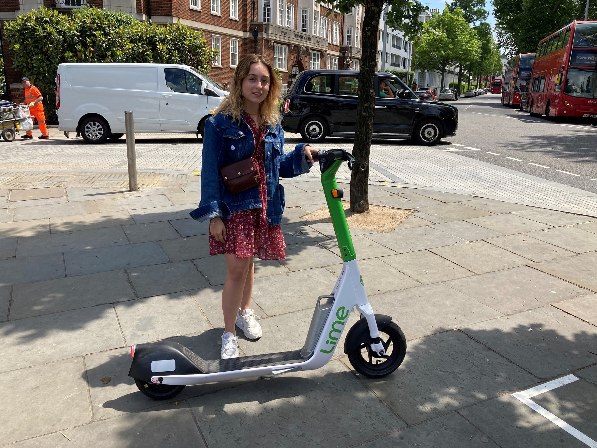 Beata Onikul, 20, hires a rental e-scooter in South Kensington, London, on the first day of a 12-month government-backed trial