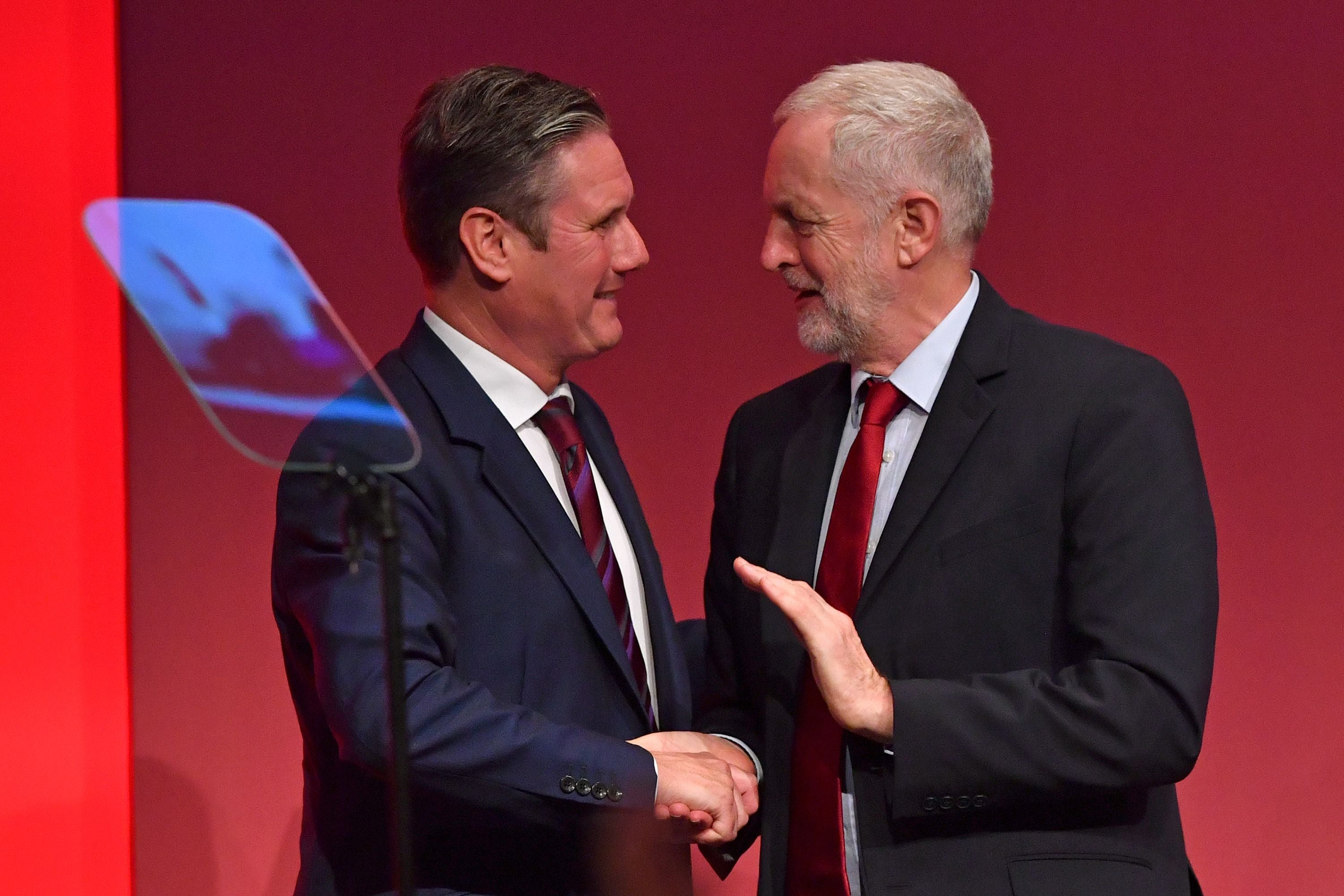 Jeremy Corbyn congratulates his then Brexit Secretary Keir Starmer after he delivers a speech to the Labour Party Conference in Brighton in September 2017