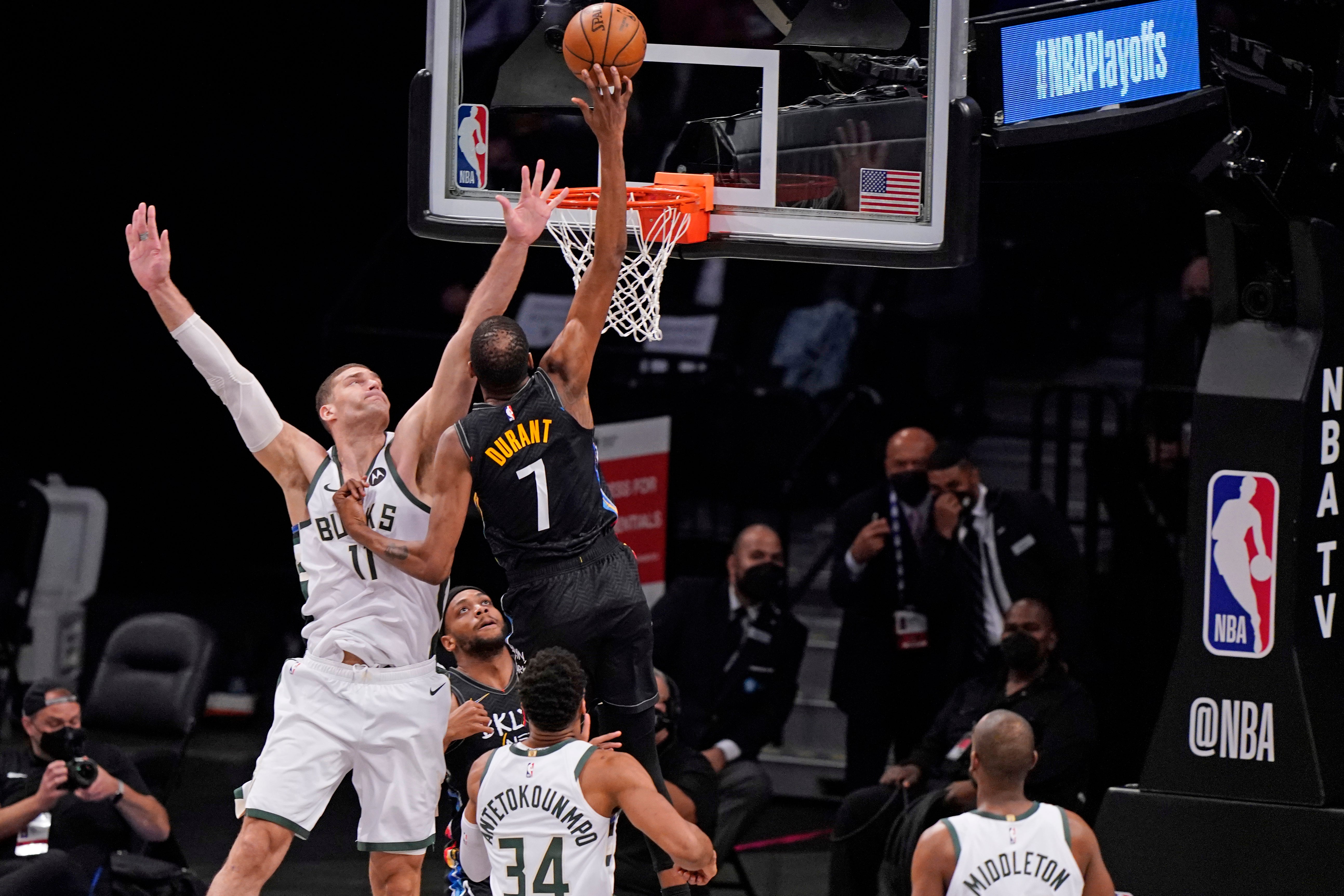 Kevin Durant soars for a basket in the first half of Brooklyn's crushing win over Milwaukee