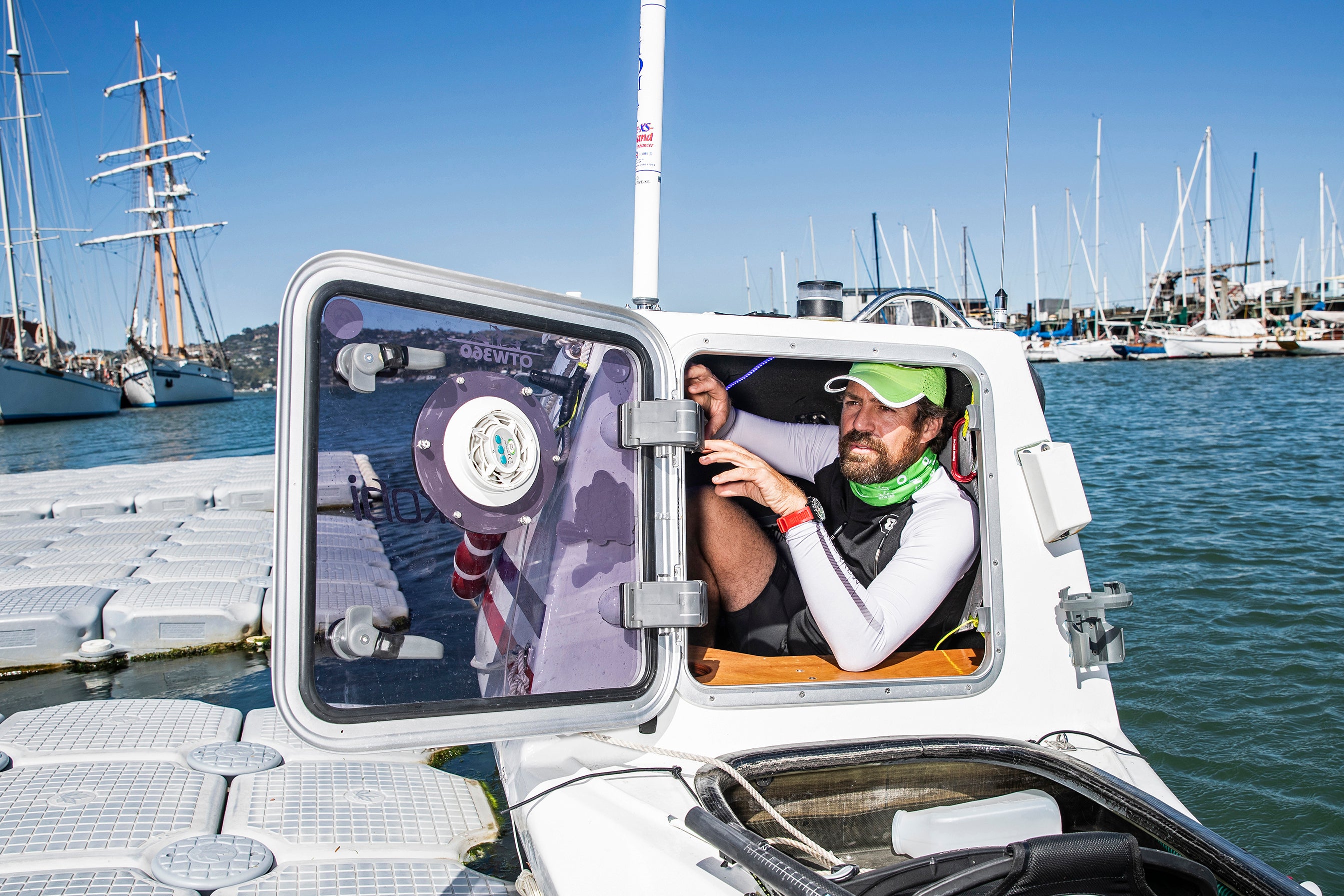 Cyril Derreumaux is seen from the sleeping quarters of his custom ocean kayak in Sausalito, Calif