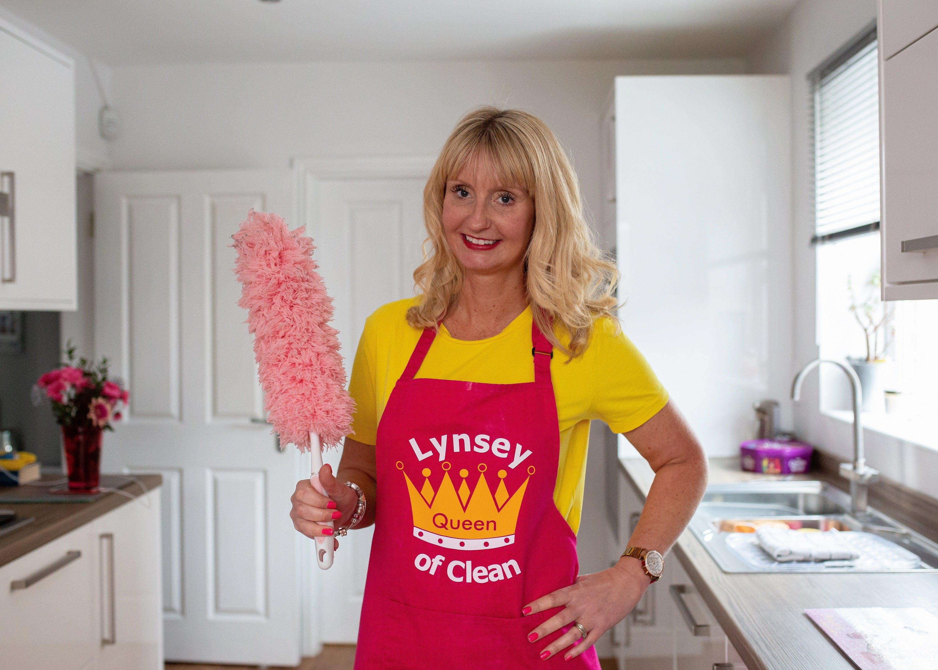 Lynsey Crombie with a feather duster (Lynsey Queen of Clean/PA)