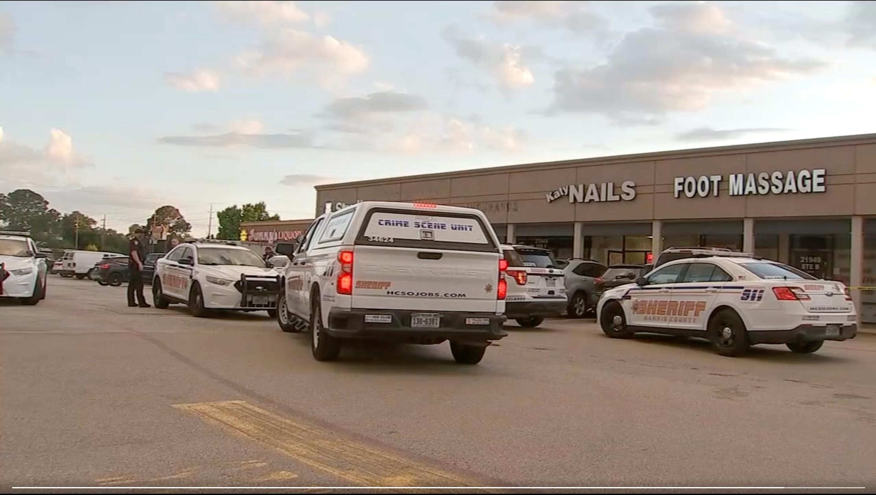 Police cars outside Katy Nails in Houston, Texas