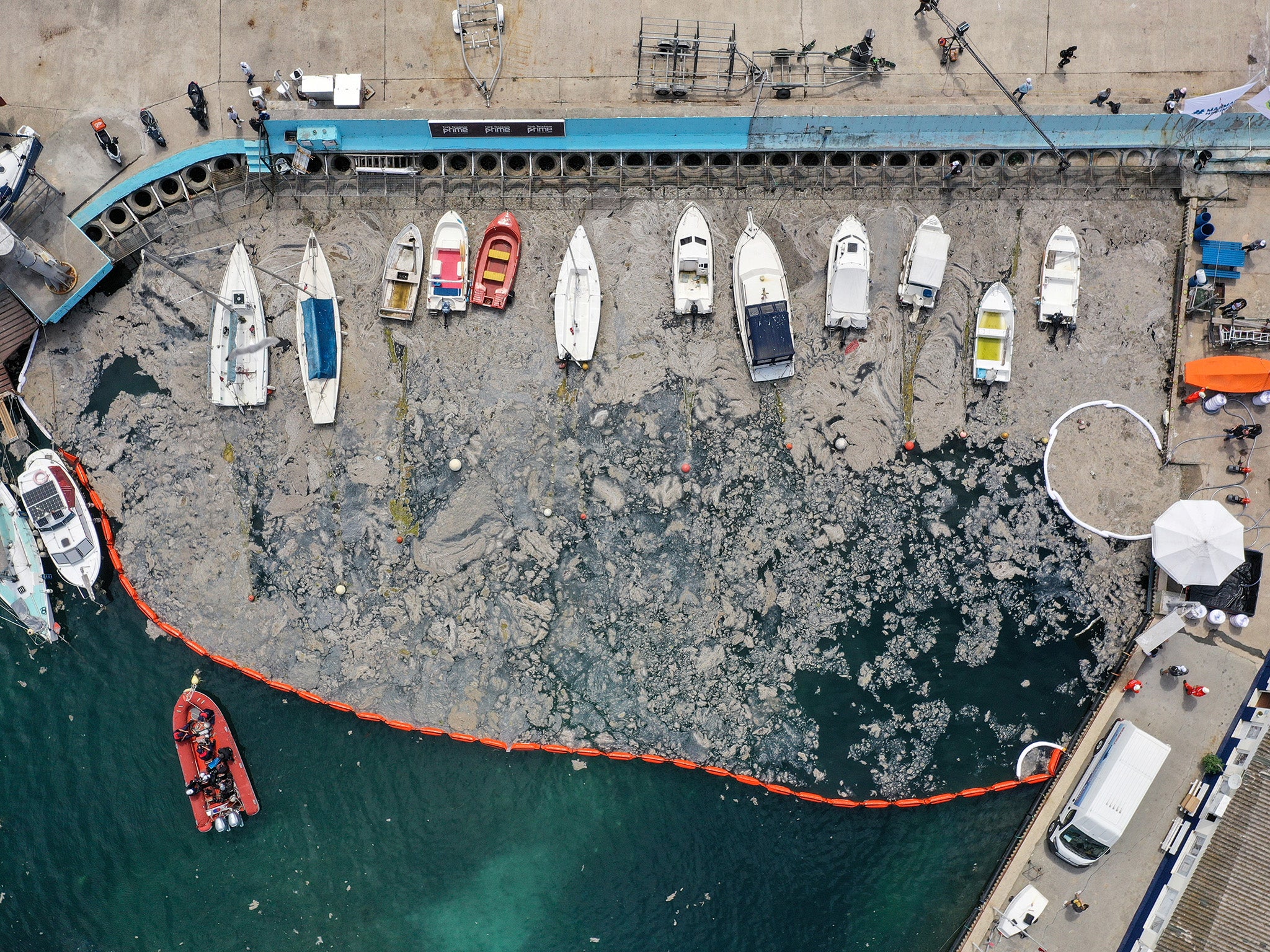 Barrier surrounds ‘sea snot’ as part of clean-up operation