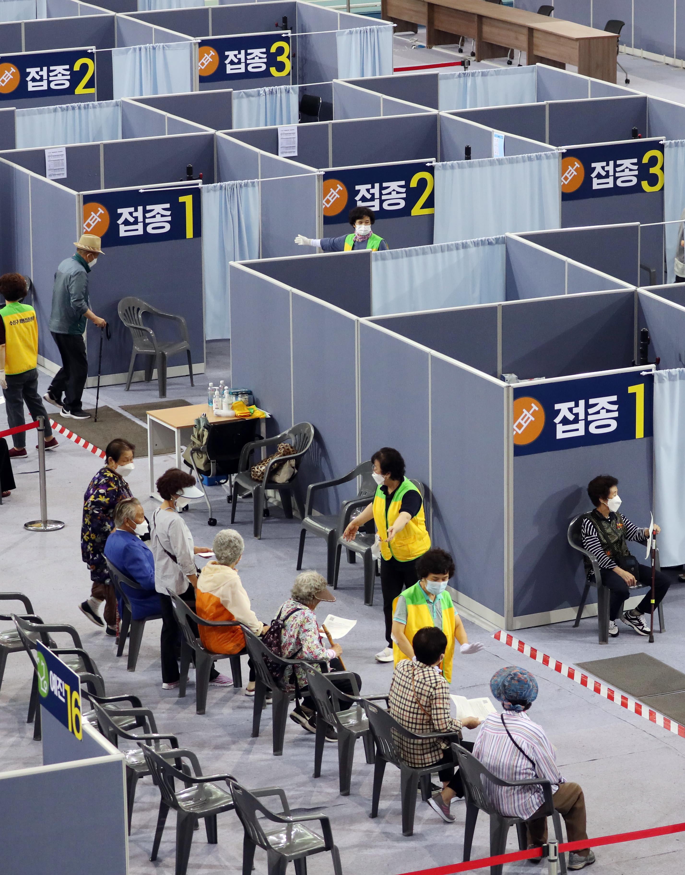 People wait to receive Covid-19 vaccine at a mass vaccination centre in Daegu, South Korea, on 8 June, 2021.