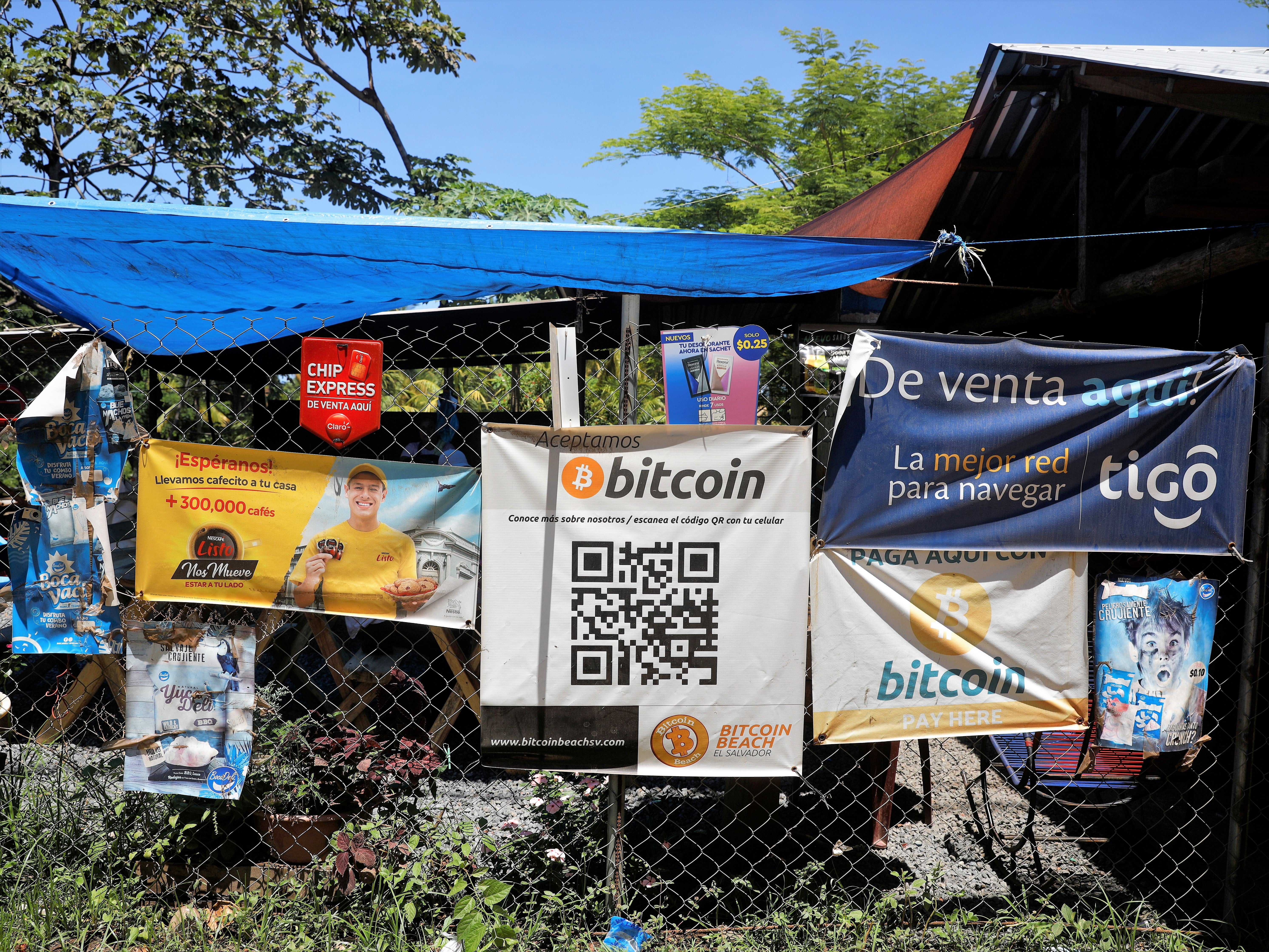 Bitcoin banners are seen outside of a small restaurant at El Zonte Beach in Chiltiupan, El Salvador 8 June, 2021