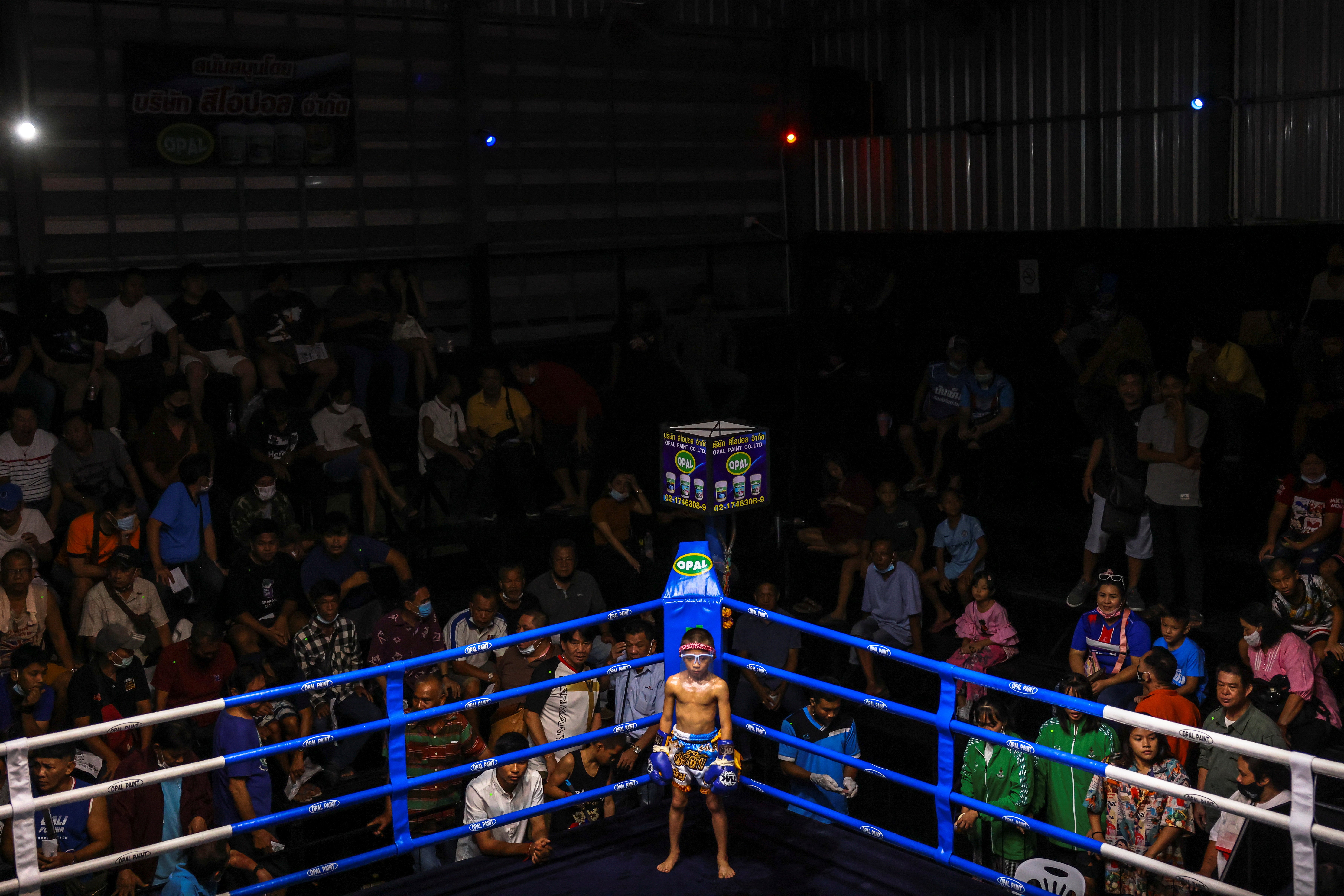 Tata stands in the ring before a fight