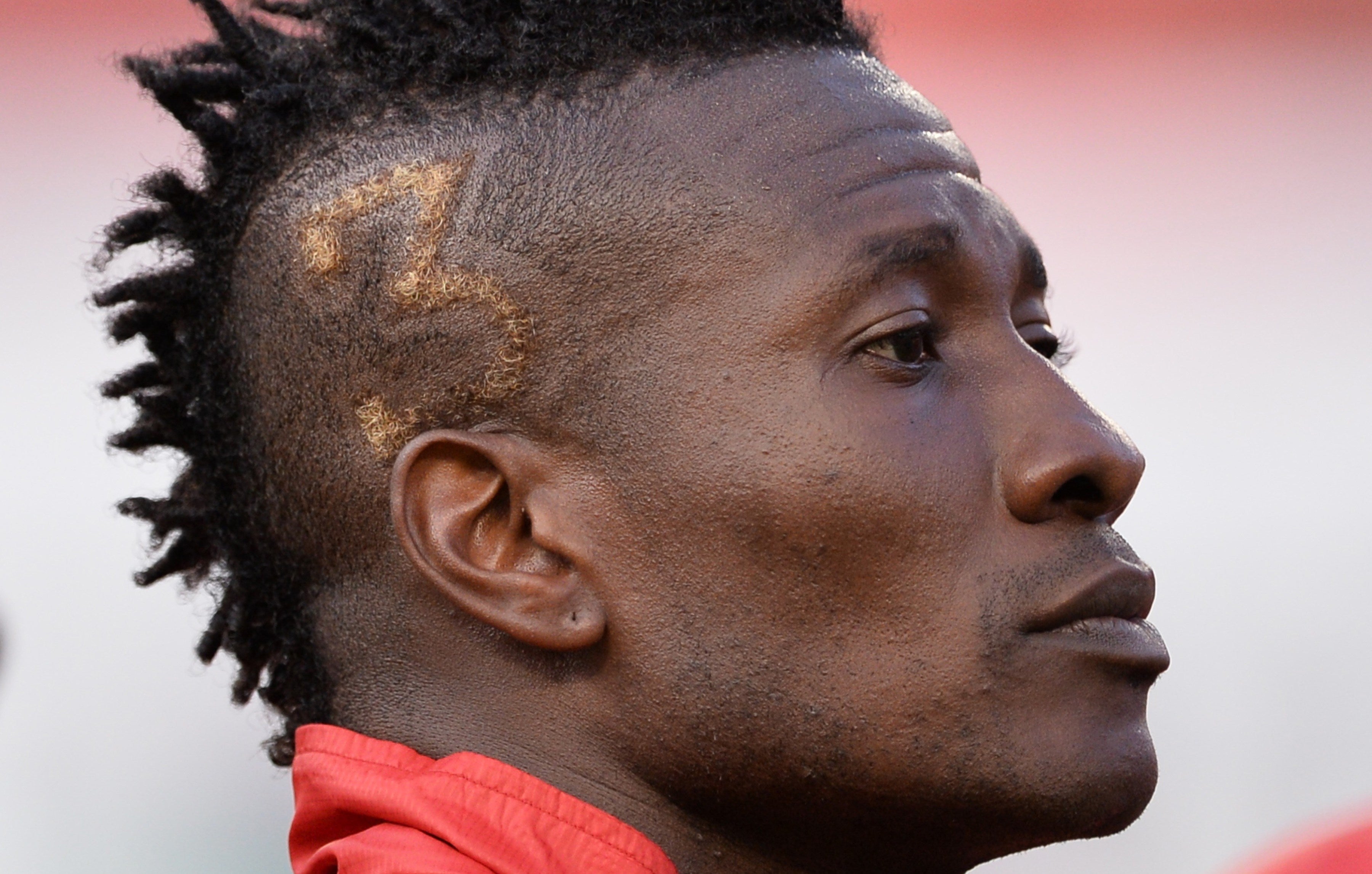 Gyan is seen with his squad number shaved on his head during the friendly match between Ghana and South Korea in 2014