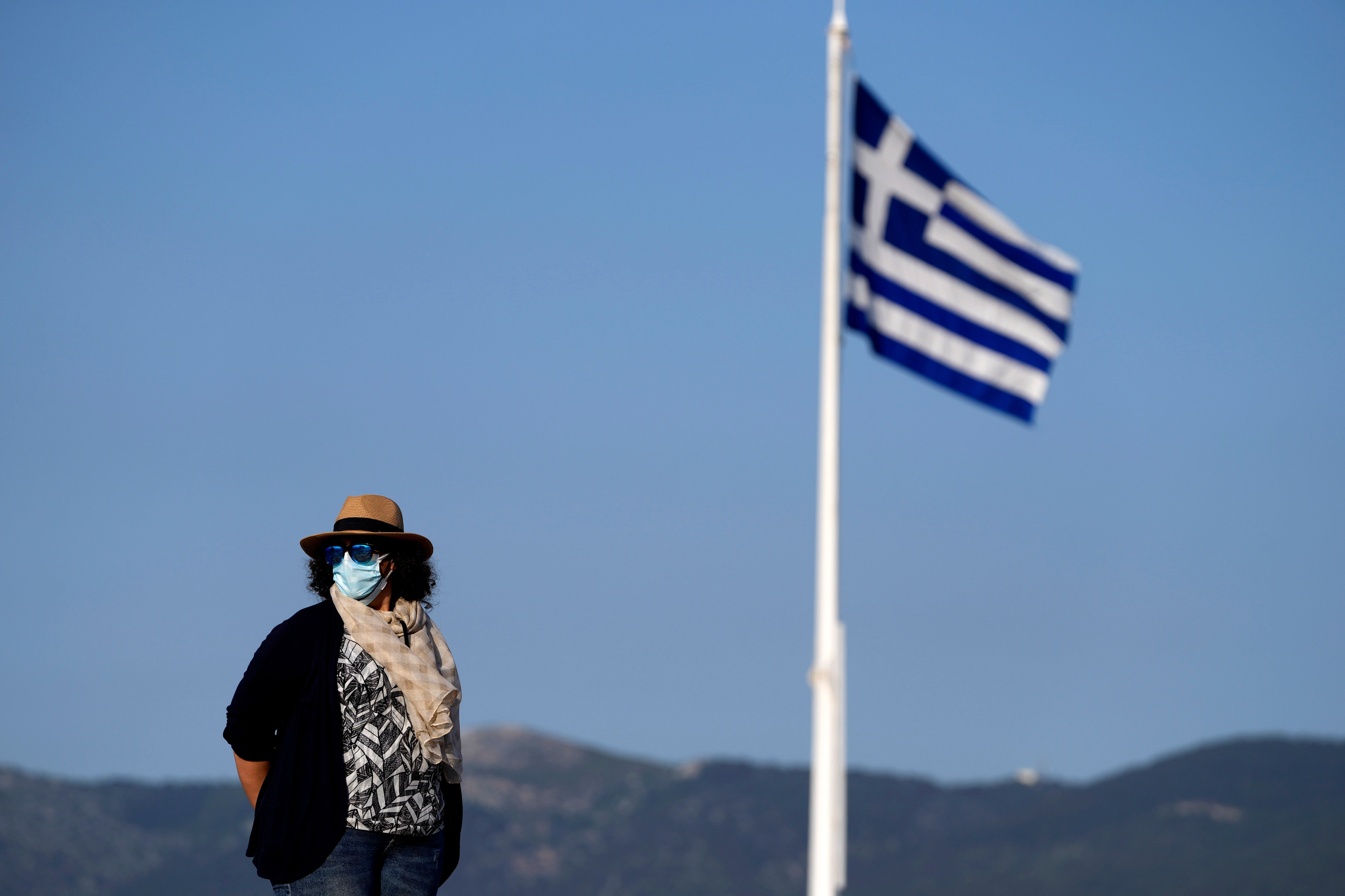 A masked guide at Athens’ Acropolis