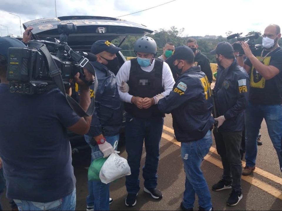 Golfer Angel Cabrera is handcuffed by police officers in Argentina