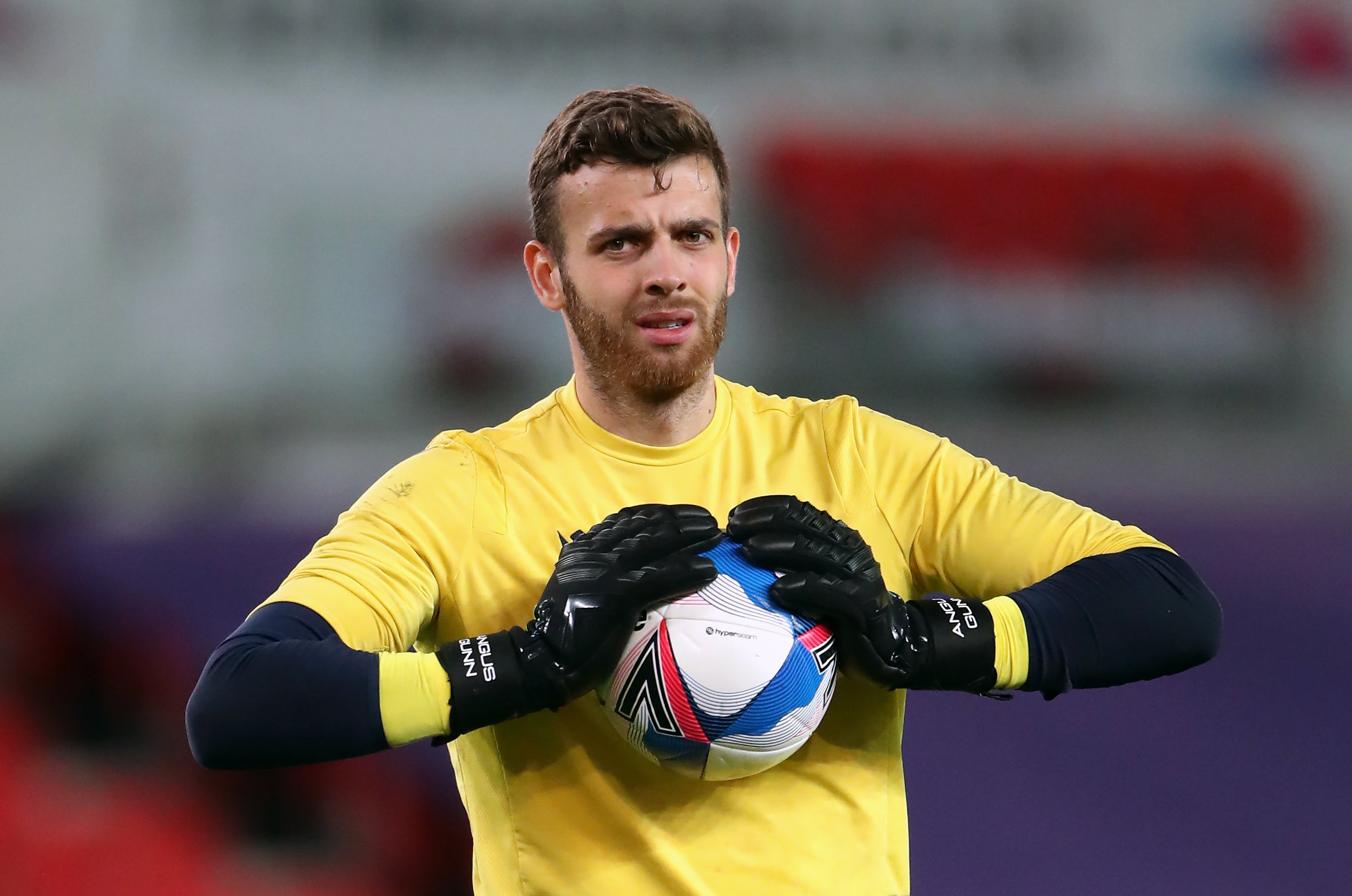 Goalkeeper Angus Gunn warming up