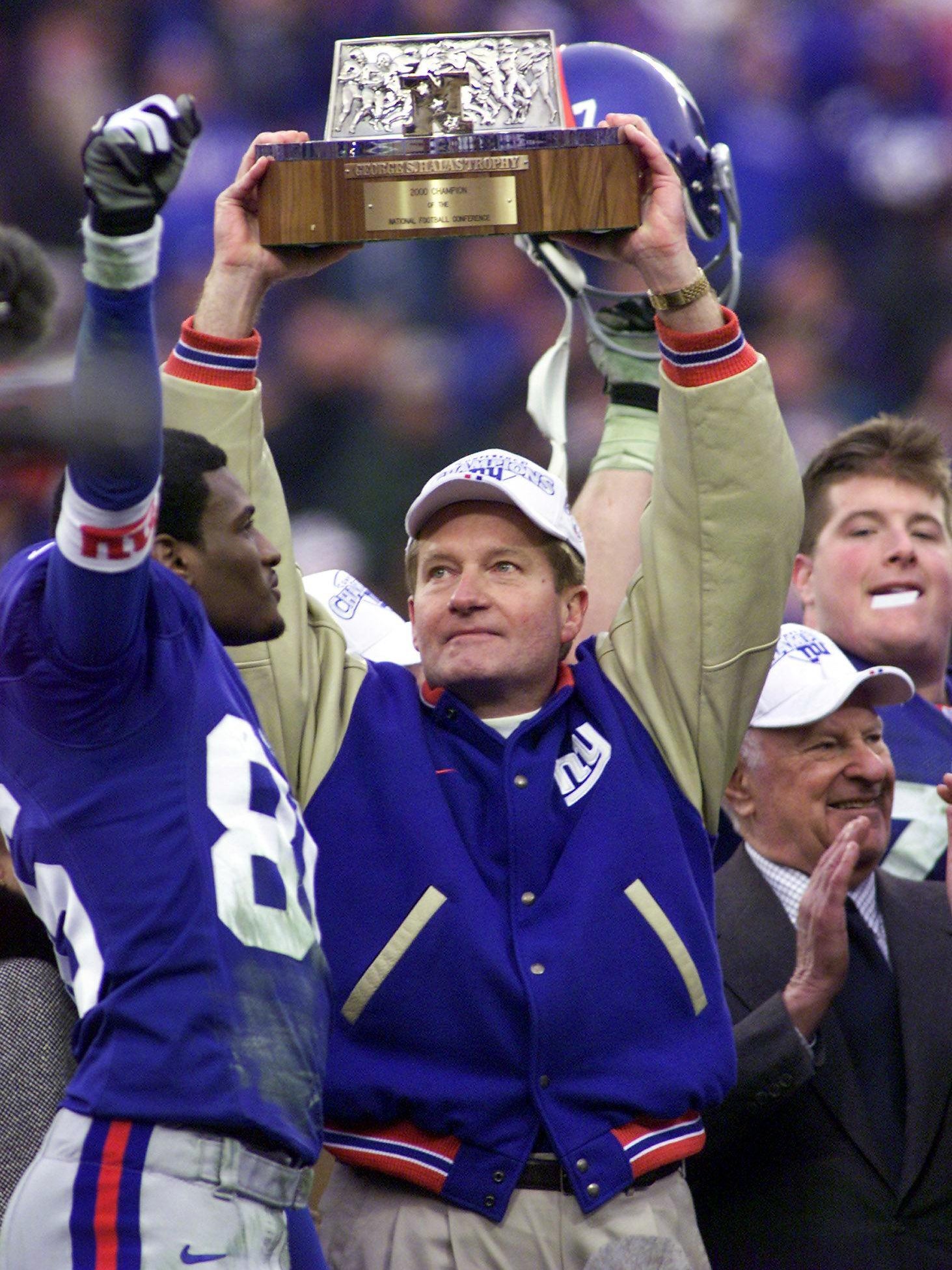 Fassel lifts the NFC Championship trophy in 2001