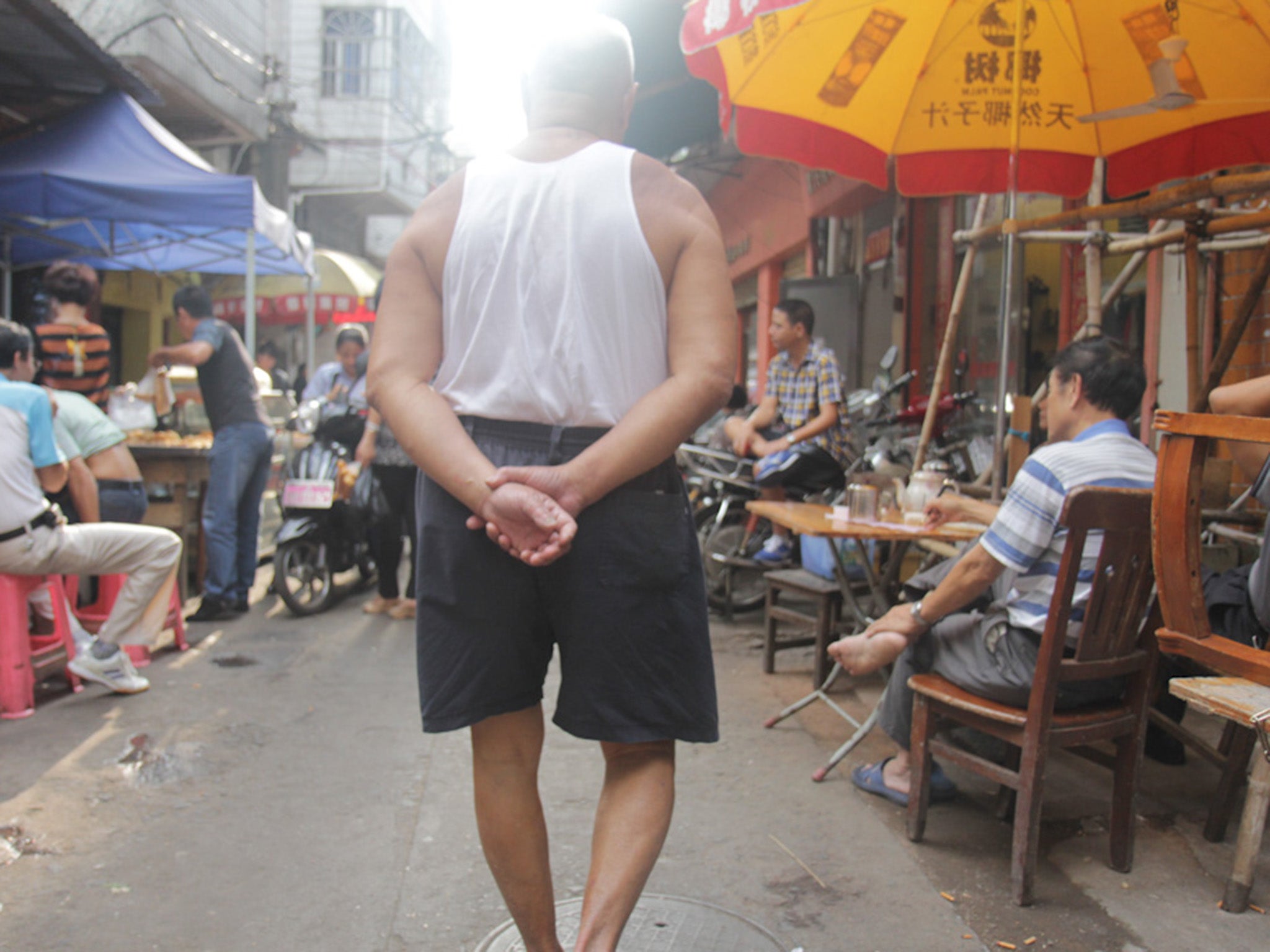 Walking along a side street of Hainan, where gay men are only visible as gay men to one another