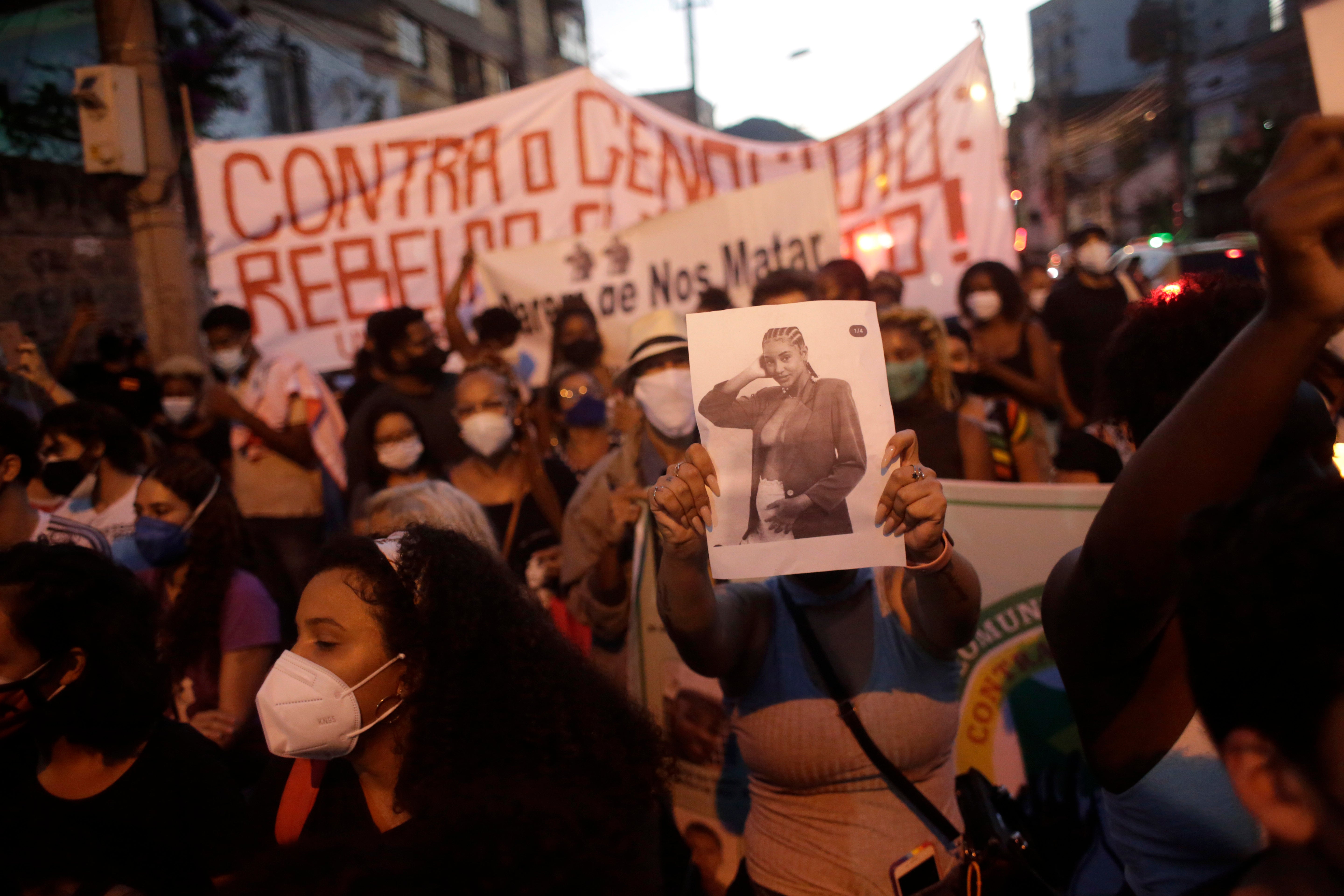 Family and activists protest the day after the death of Kathlen Romeu, a young pregnant woman killed by a stray bullet, in Rio de Janeiro