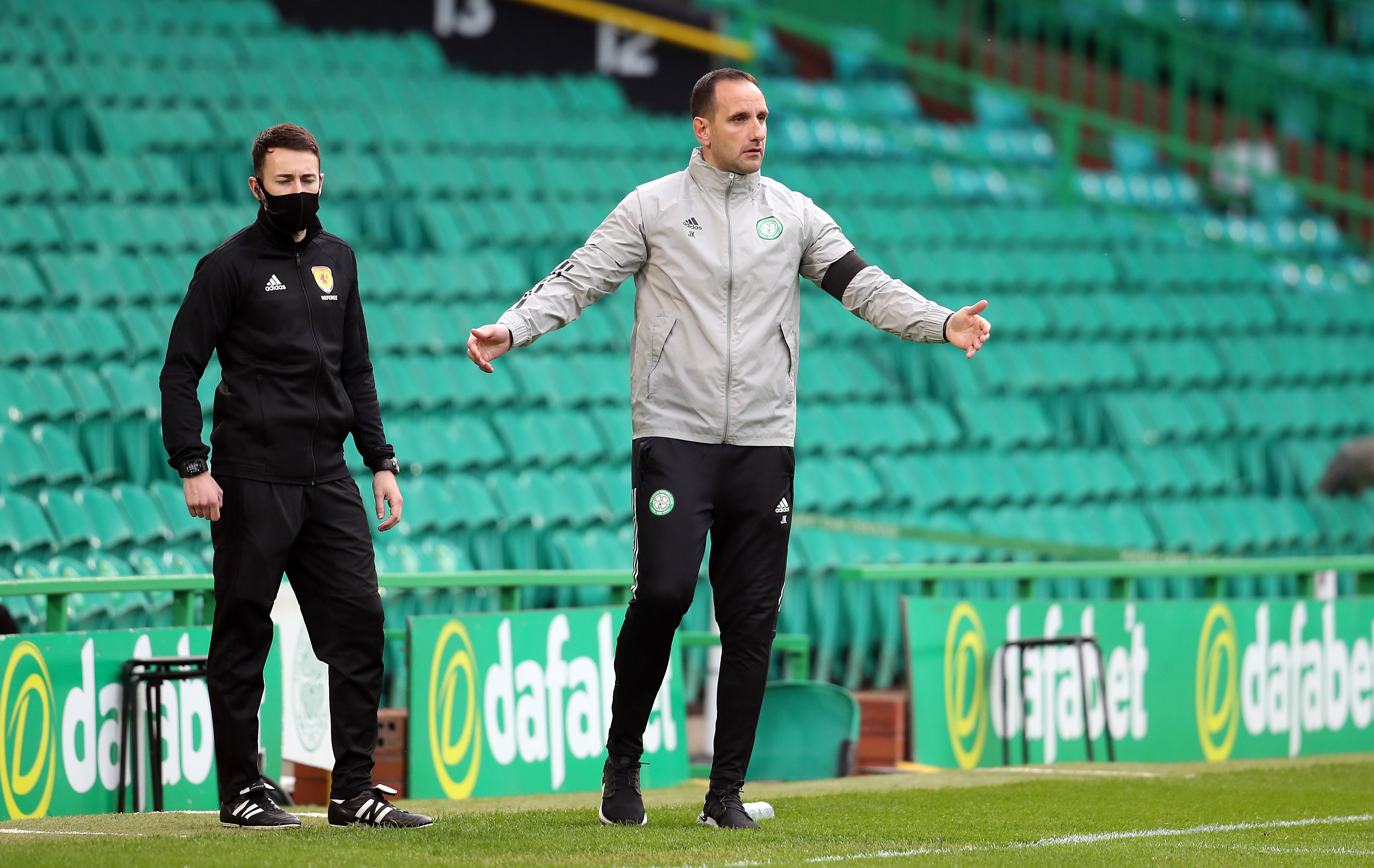 John Kennedy, centre, on the touchline
